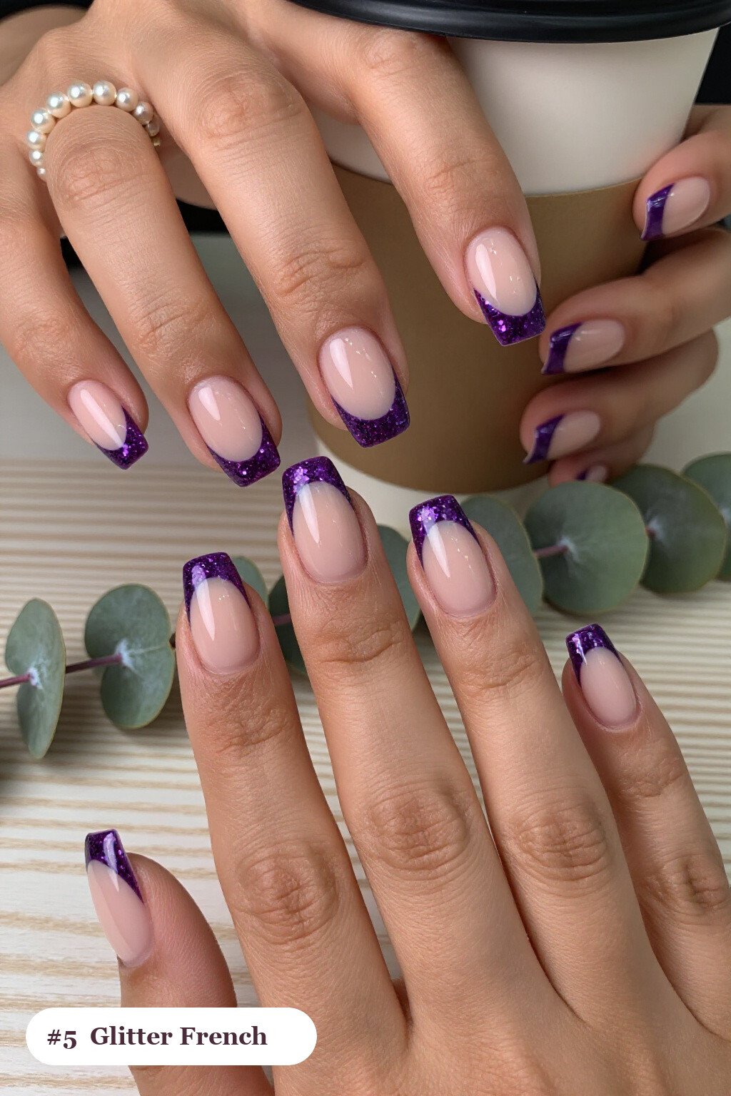 Short square deep purple charms nails with glitter-packed french tips over a sheer nude base, perfect for halloween - halloween nails with charms