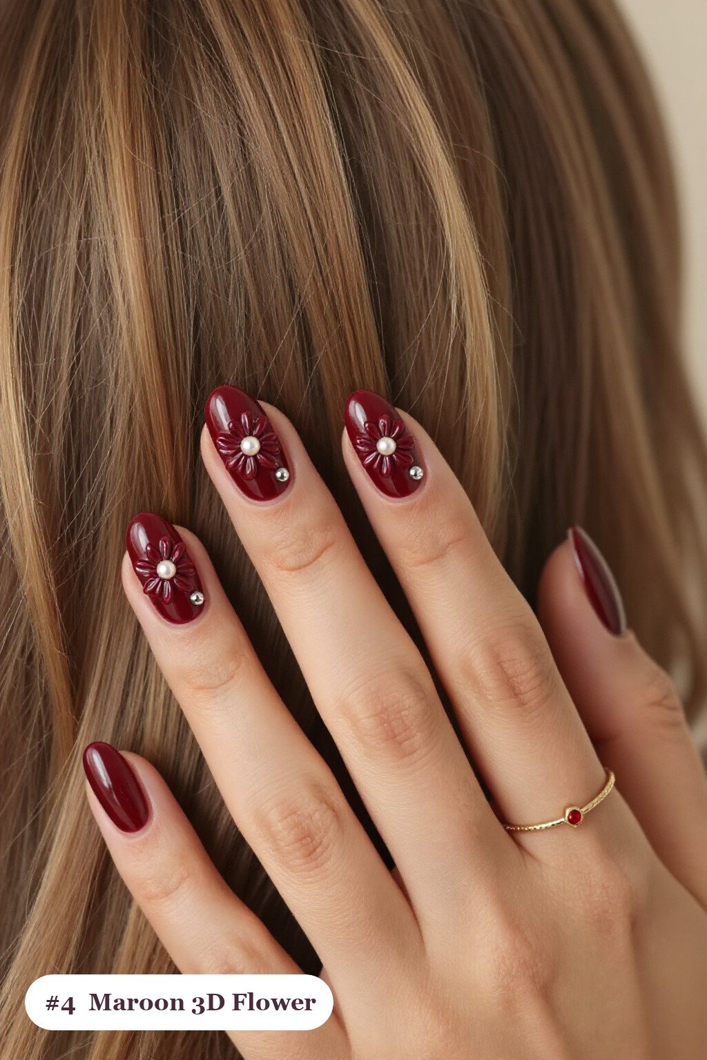 Medium oval maroon nails with raised 3D flowers with pearl centres on two accent nails, with silver chrome details, perfect for fall - maroon fall nails Medium oval maroon nails with raised 3D flowers with pearl centres on two accent nails, with silver chrome details, perfect for fall - maroon fall nails