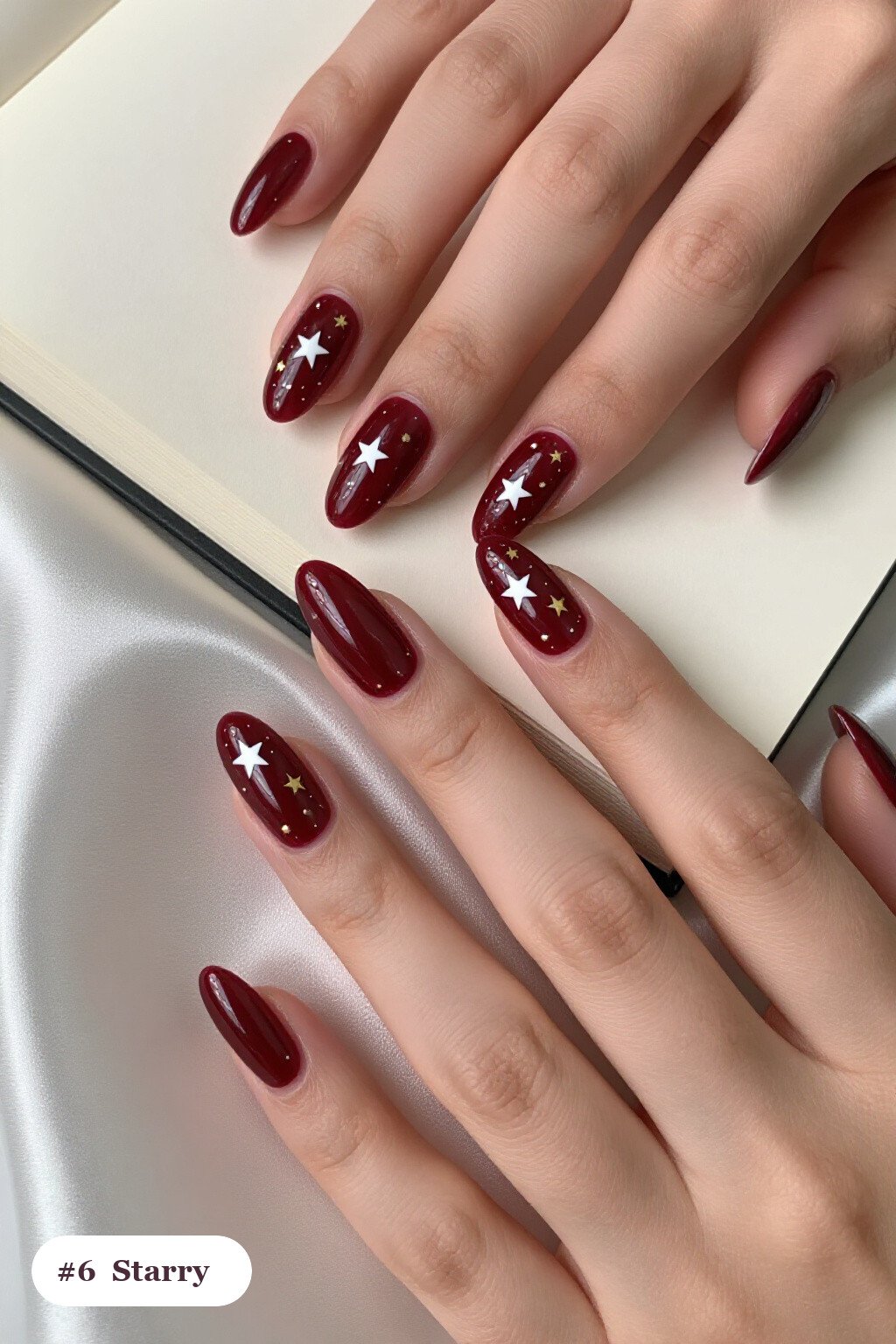 Long Almond Burgundy Nails Sparkling with White and Gold Stars: Best Shades for Every Season - october fall nail designs