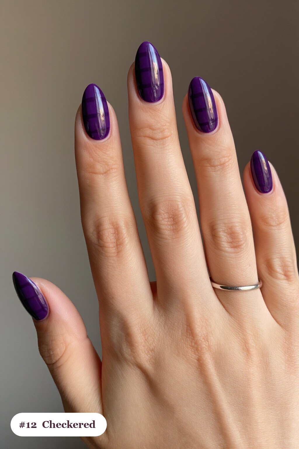 Medium almond deep purple october nails with a bold checkerboard pattern on two accent nails and solid colour on the rest, perfect for halloween - october halloween nail designs Medium almond deep purple october nails with a bold checkerboard pattern on two accent nails and solid colour on the rest, perfect for halloween - october halloween nail designs
