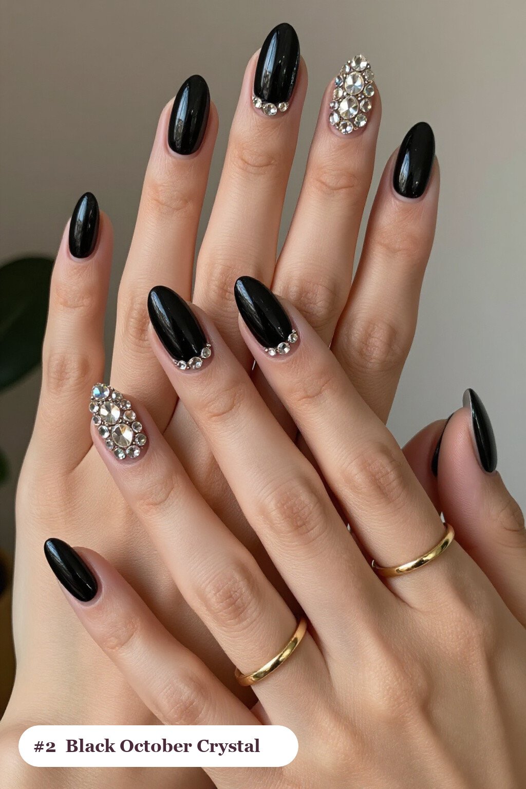 Medium almond black october nails with rows of sparkling crystal rhinestones along the cuticle of every nail, perfect for halloween - october halloween nail designs Medium almond black october nails with rows of sparkling crystal rhinestones along the cuticle of every nail, perfect for halloween - october halloween nail designs