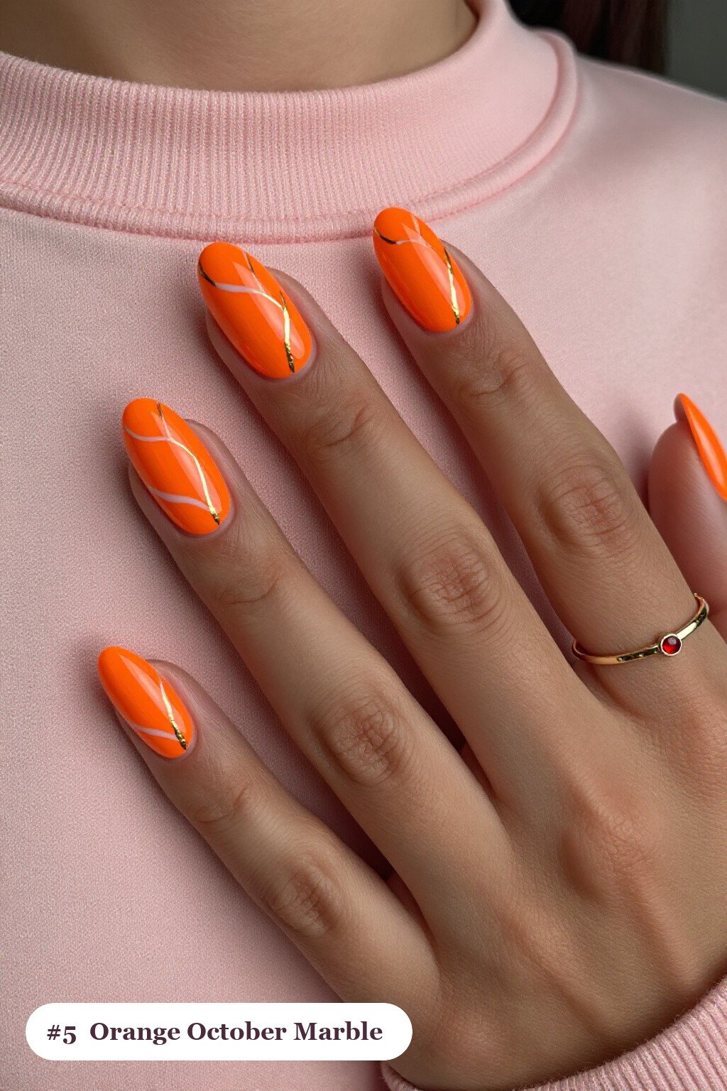 Medium oval orange october nails with bold marble veins in white and gold across every nail, perfect for halloween - october halloween nail designs Medium oval orange october nails with bold marble veins in white and gold across every nail, perfect for halloween - october halloween nail designs