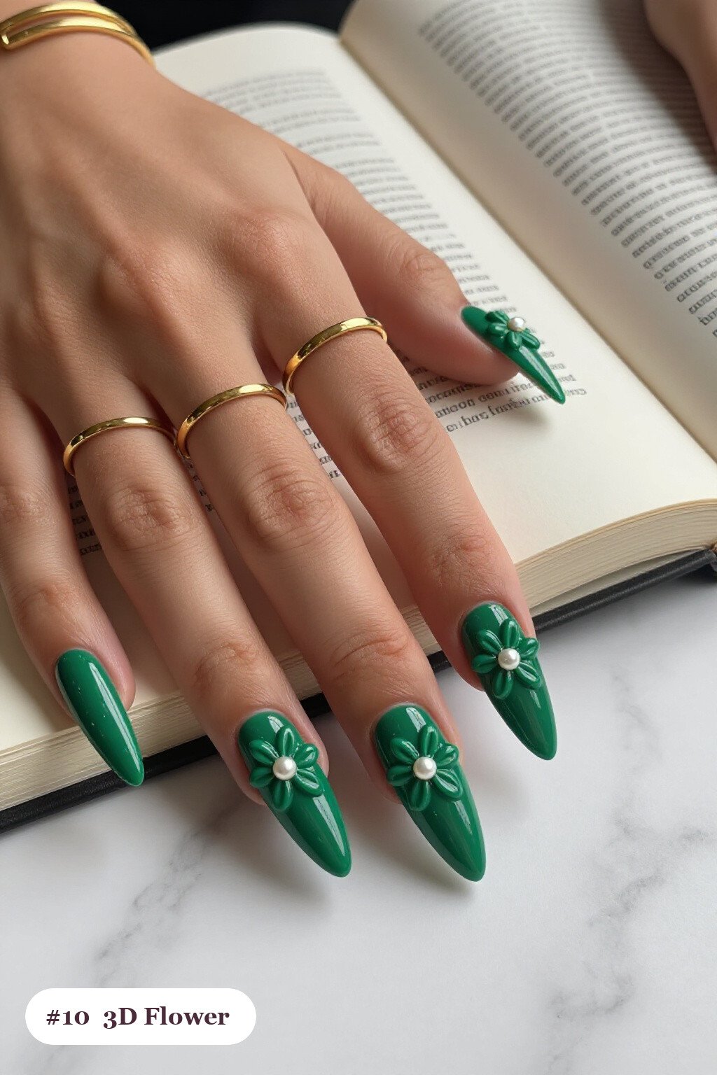 Long stiletto emerald green october nails with raised 3D flowers with pearl centres on two accent nails - october nail ideas Long stiletto emerald green october nails with raised 3D flowers with pearl centres on two accent nails - october nail ideas