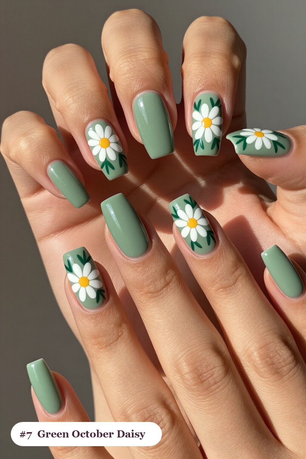 Long square sage green october nails with hand-painted daisies and green leaves across every nail - october nail ideas Long square sage green october nails with hand-painted daisies and green leaves across every nail - october nail ideas