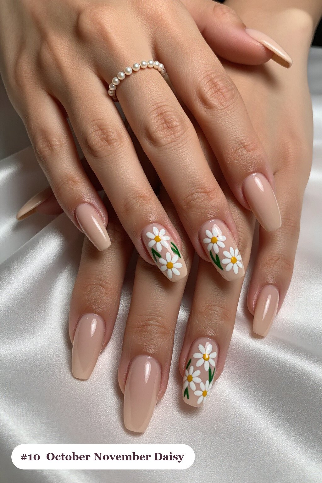 Long square nude beige october november nails with hand-painted daisies and green leaves across every nail - october november nail designs