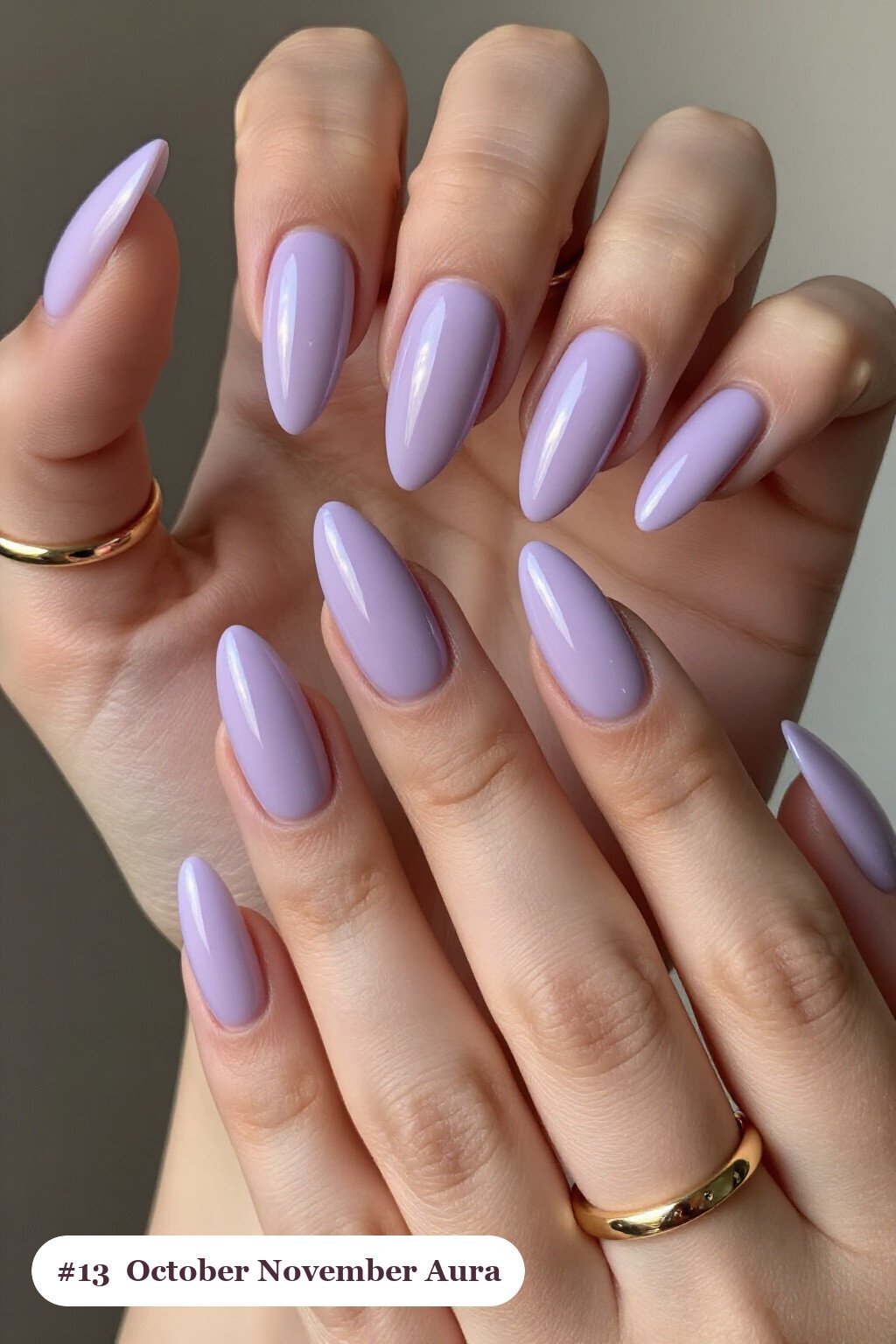 Long stiletto lavender october november nails with a glowing airbrushed aura in the centre of each nail - october november nail designs