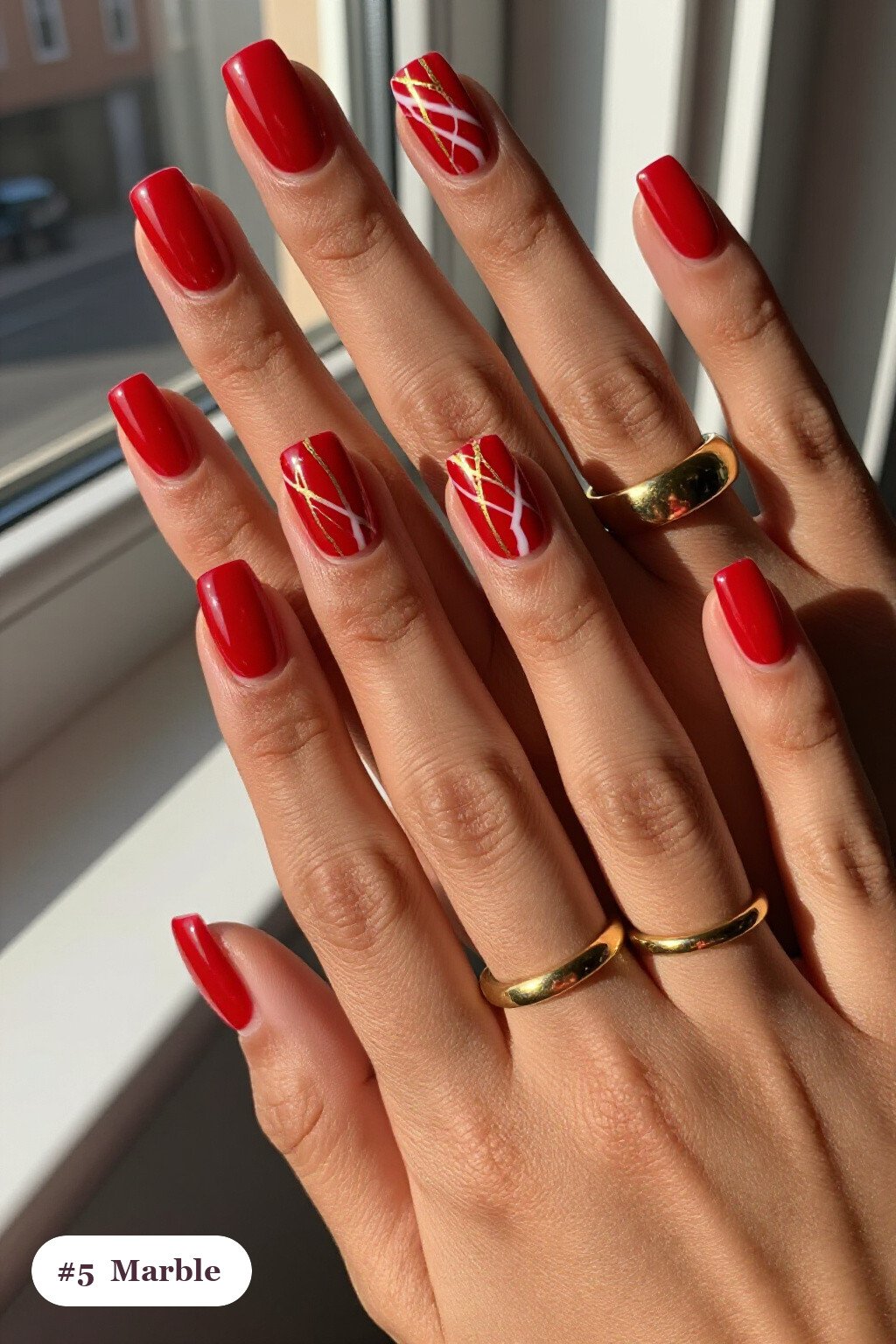 Short square cherry red october november nails with bold marble veins in white and gold across every nail - october november nail designs