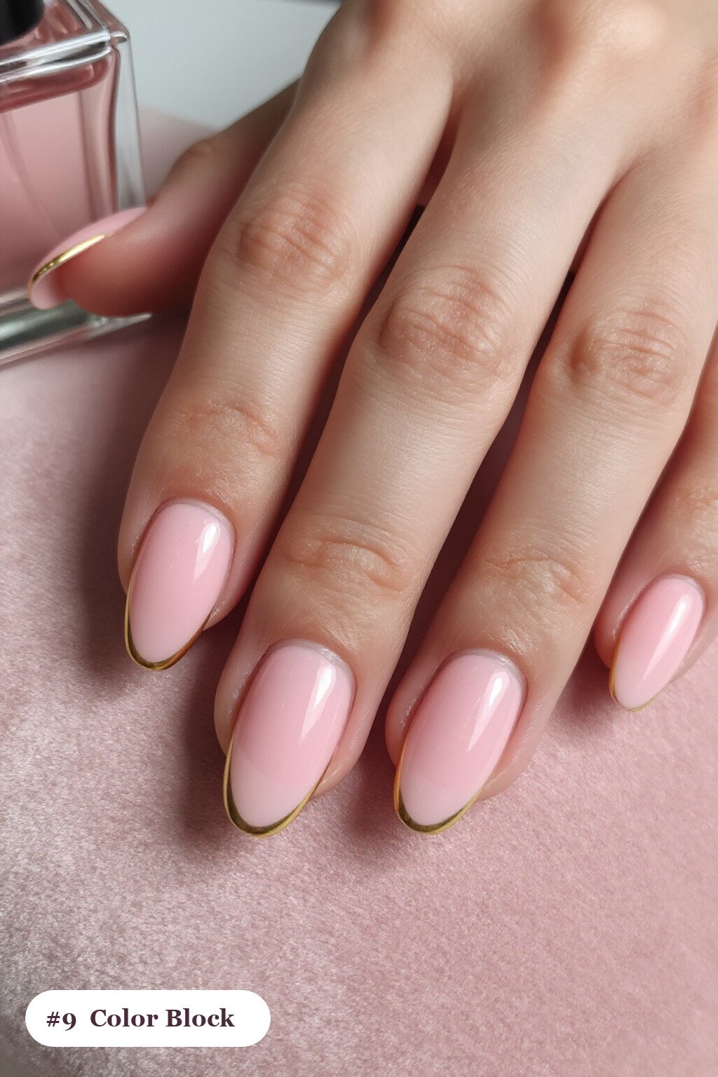 Medium coffin baby pink october november nails in a colour-block design split diagonally with a thin gold line - october november nail designs