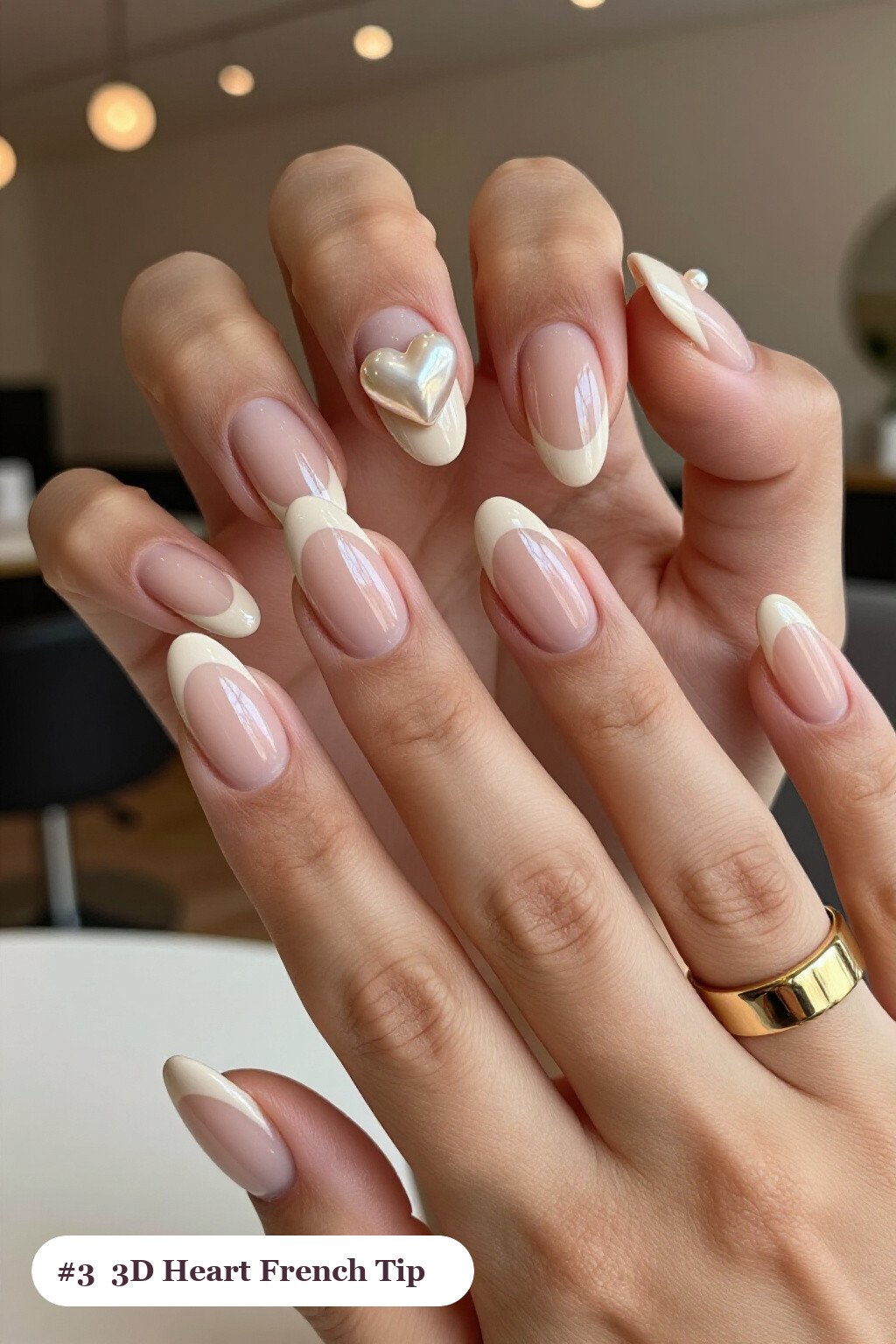 Medium almond nude beige ombre french nails with crisp french tips and a smooth ombre gradient clearly visible on every nail, styled with chunky 3D gel hearts and pearls on three nails - ombre french almond nails