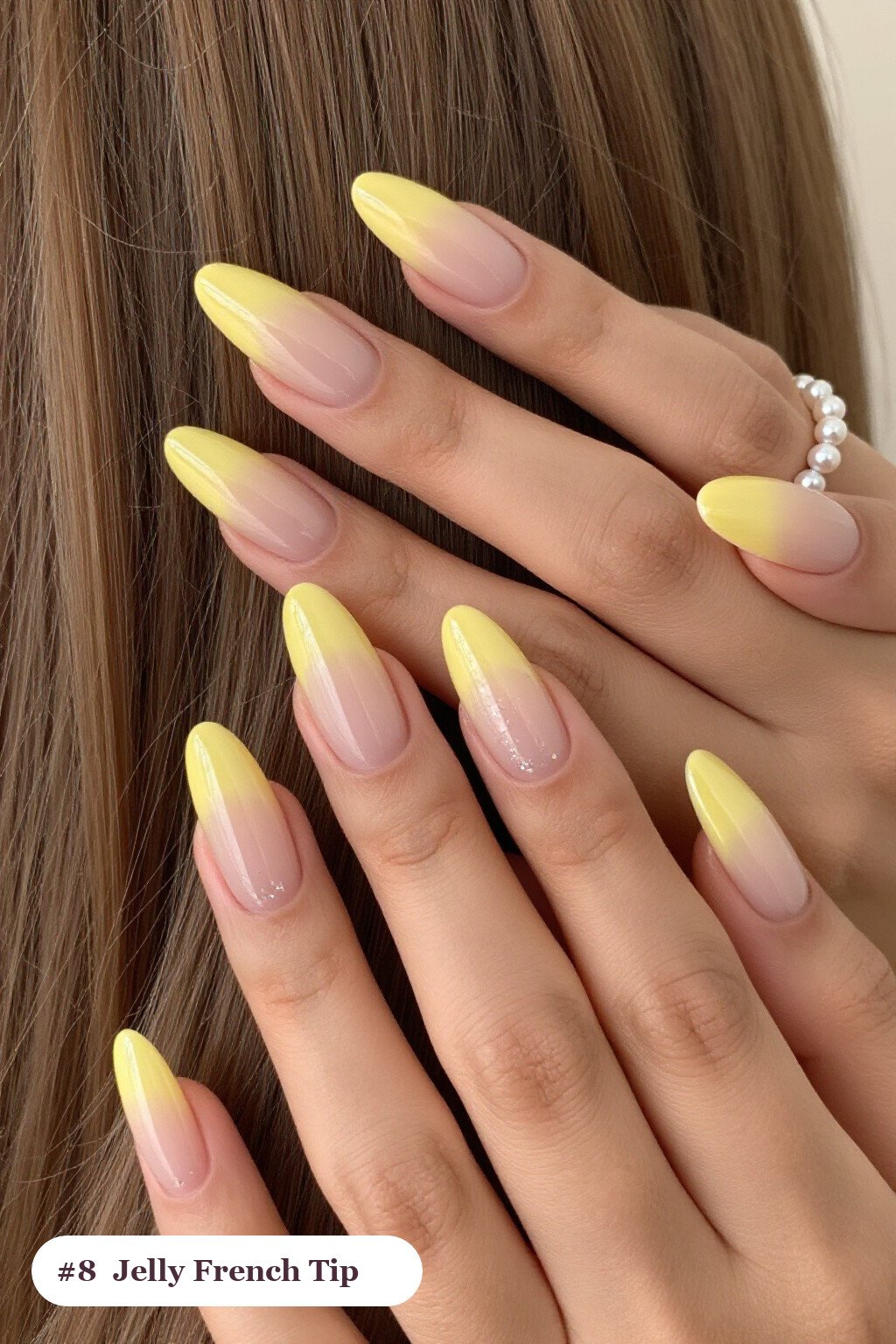 Medium almond butter yellow ombre french nails with crisp french tips and a smooth ombre gradient clearly visible on every nail, styled with a see-through jelly finish with encapsulated glitter - ombre french almond nails