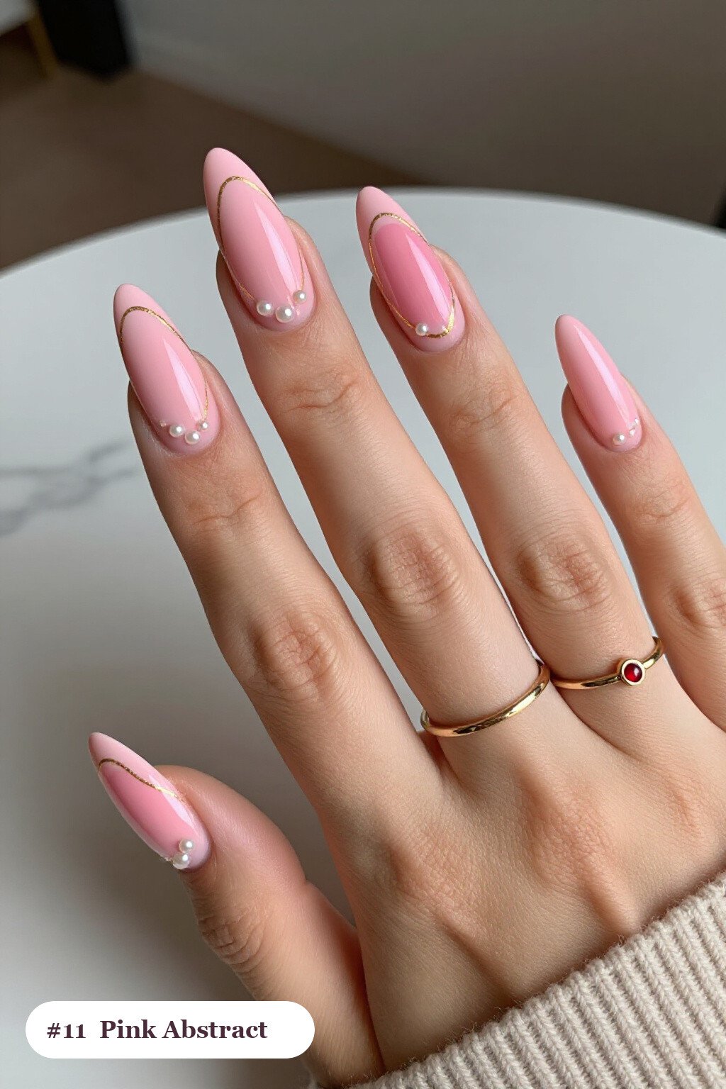 Long almond pink nails with abstract art of colour blobs, gold outlines and dots, with pearl details - pink nails Long almond pink nails with abstract art of colour blobs, gold outlines and dots, with pearl details - pink nails