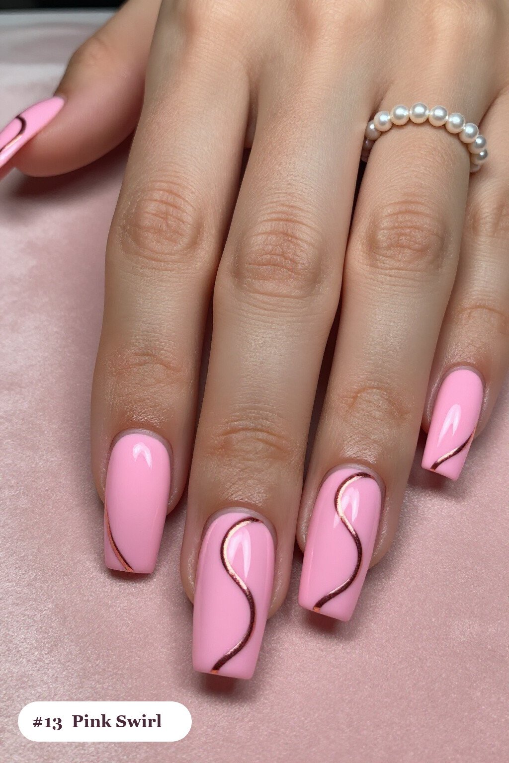Long square pink nails with bold hand-painted swirl lines flowing across every nail in a contrasting colour, with rose gold details - pink nails Long square pink nails with bold hand-painted swirl lines flowing across every nail in a contrasting colour, with rose gold details - pink nails