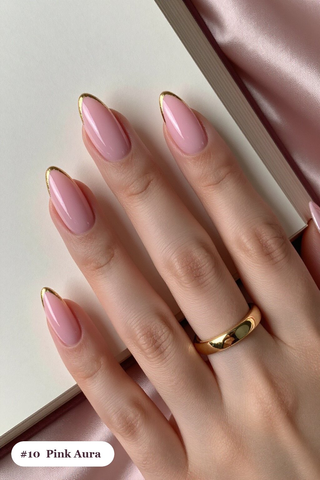 Medium almond pink nails with a glowing airbrushed aura in the centre of each nail, with gold details - pink nails almond
