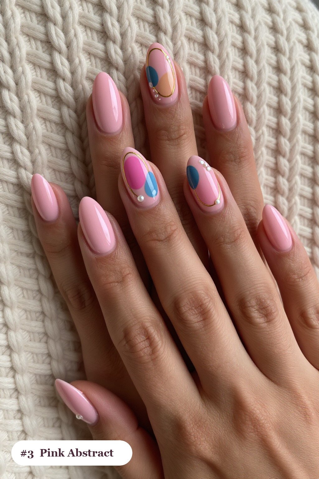 Medium almond pink nails with abstract art of colour blobs, gold outlines and dots, with pearl details - pink nails almond