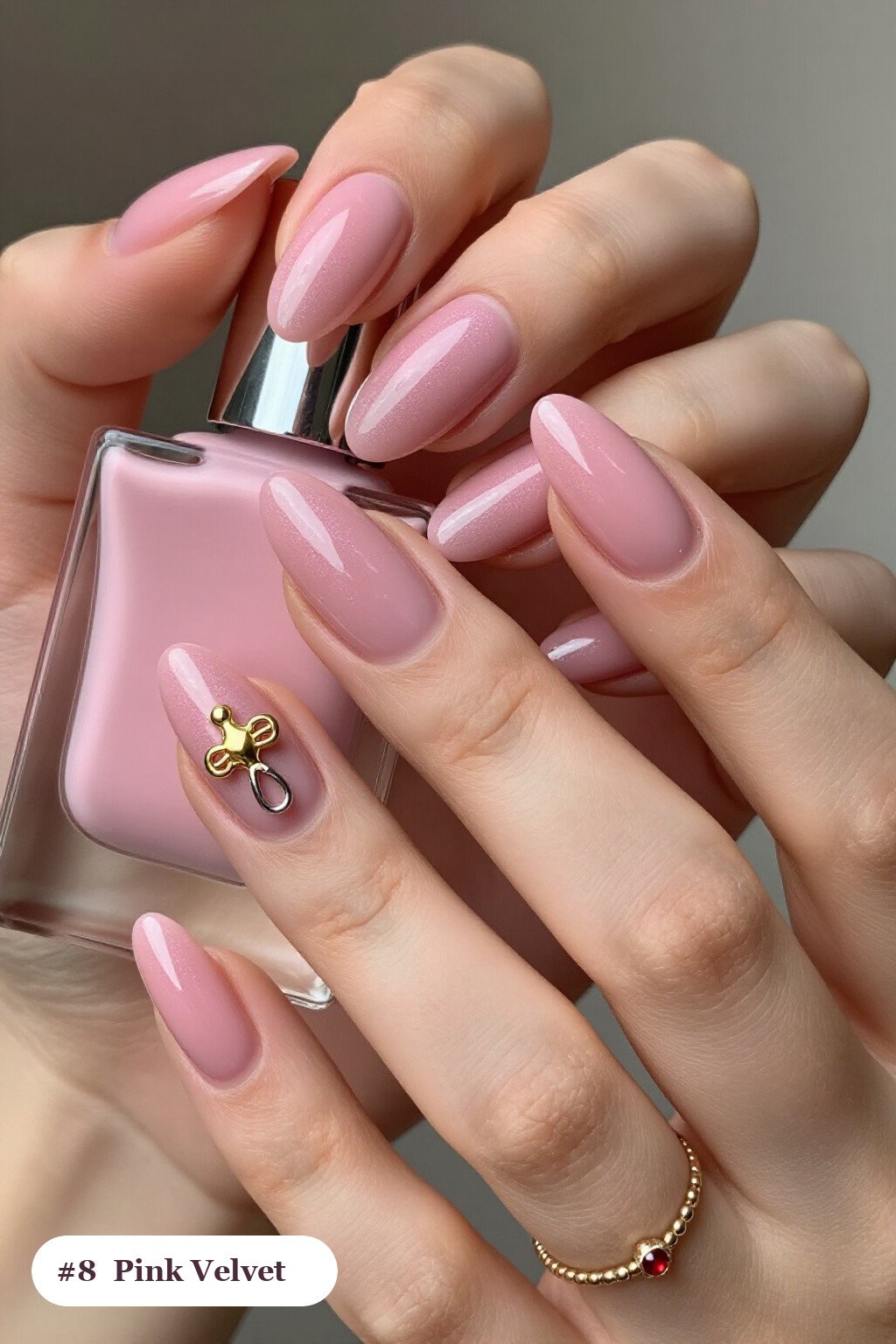 Medium almond pink nails in a velvet shimmer finish with one glossy accent nail with a gold charm, with silver chrome details - pink nails almond
