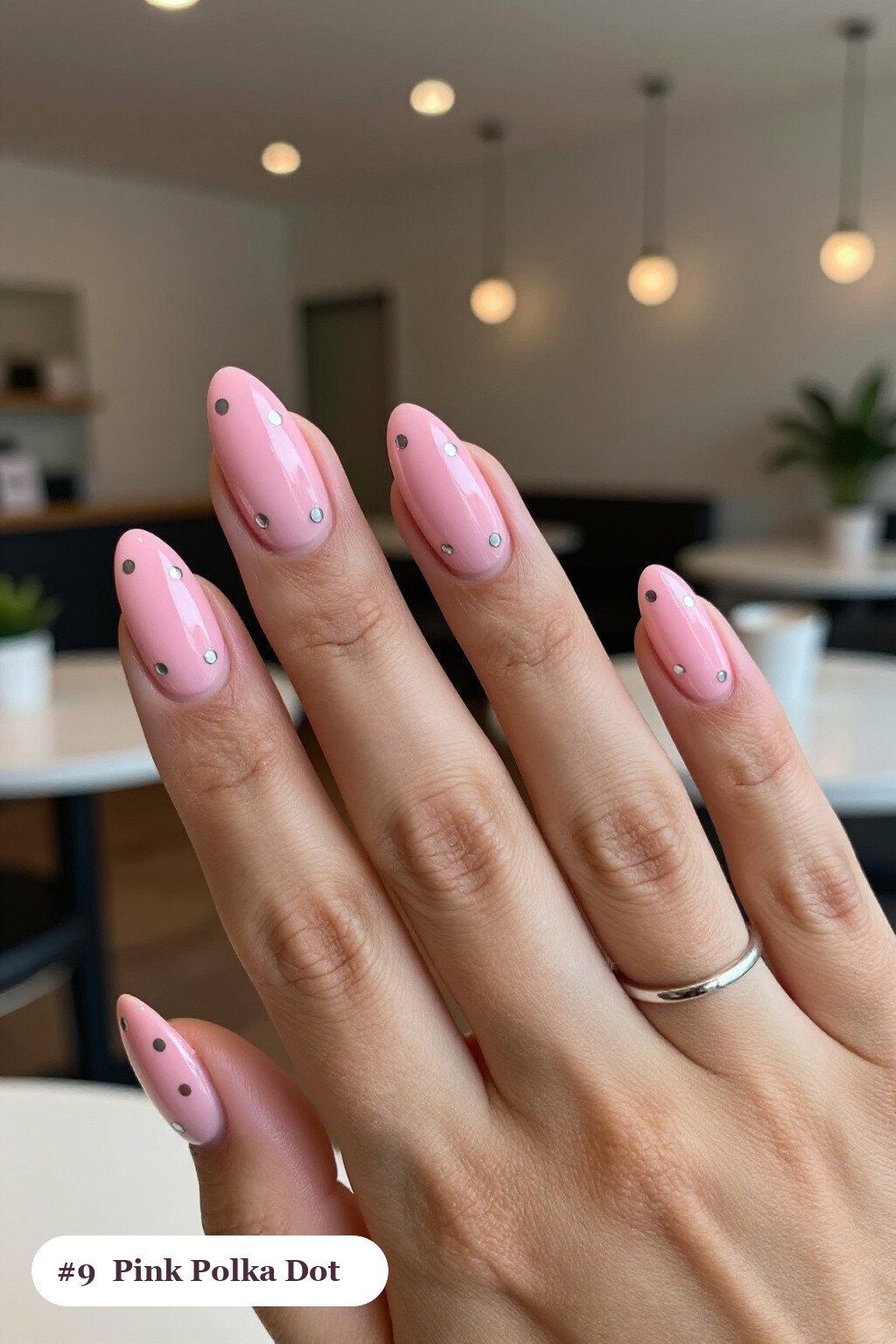 Medium almond pink nails with playful polka dots in two colours on alternating nails, with silver details - pink nails almond