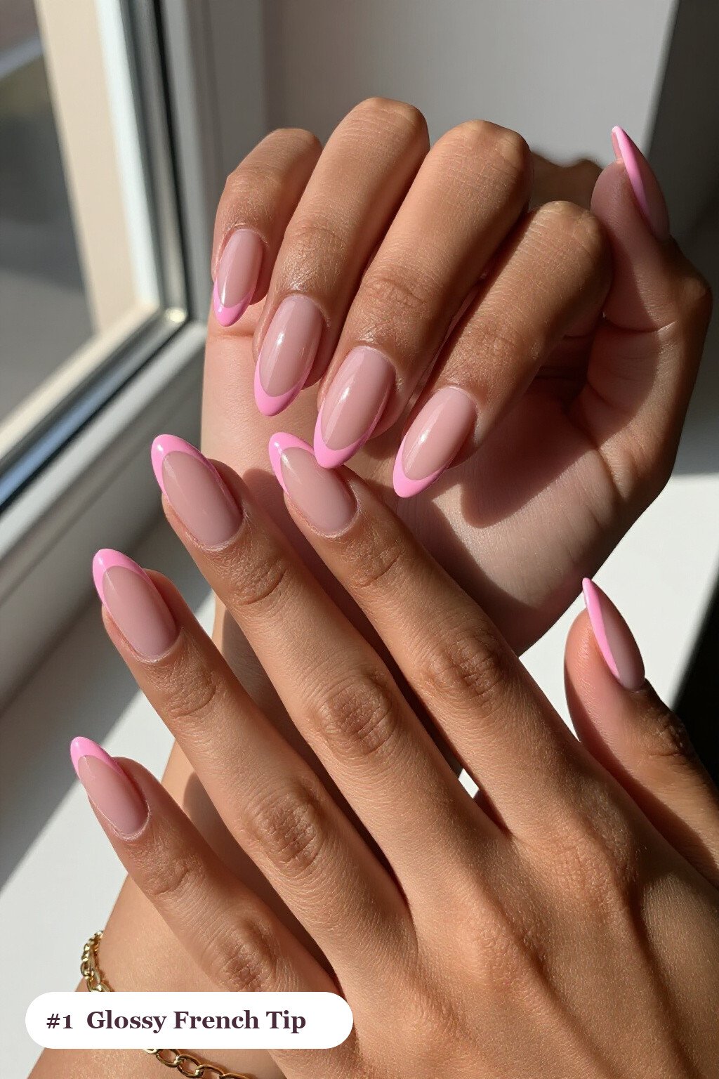 Medium almond pink french tip nails with crisp french tips clearly visible on every nail, glossy and flawless - pink nails almond french tip