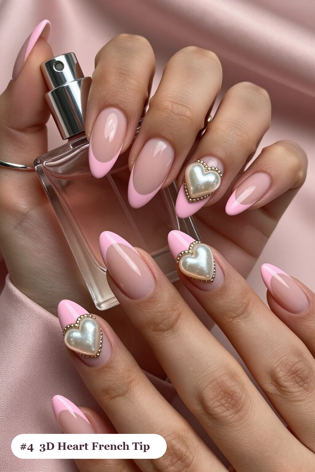Medium almond pink french tip nails with crisp french tips clearly visible on every nail, styled with chunky 3D gel hearts and pearls on three nails, with champagne details - pink nails almond french tip