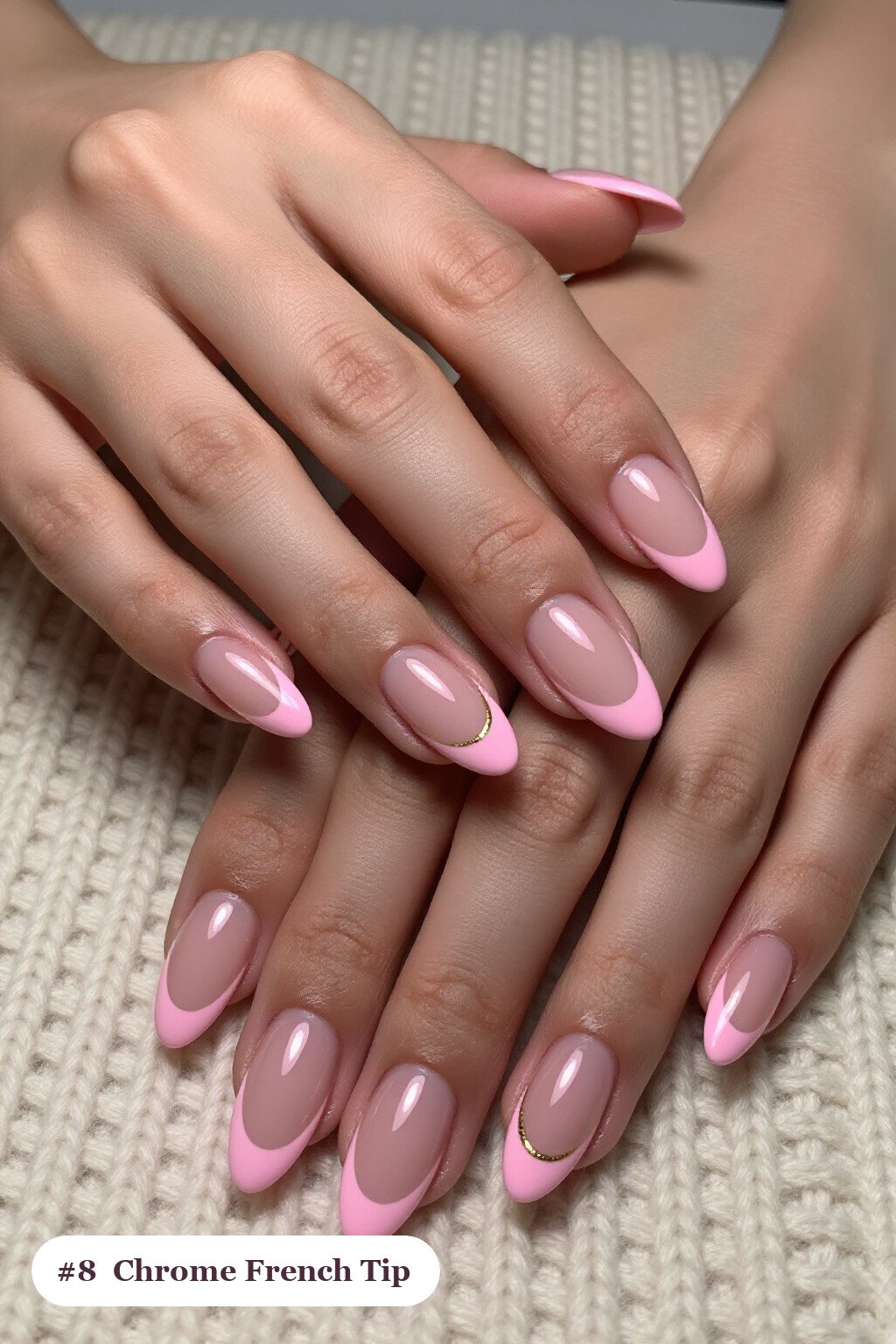 Medium almond pink french tip nails with crisp french tips clearly visible on every nail, styled with a liquid chrome mirror finish and bright metallic highlights, with gold details - pink nails almond french tip