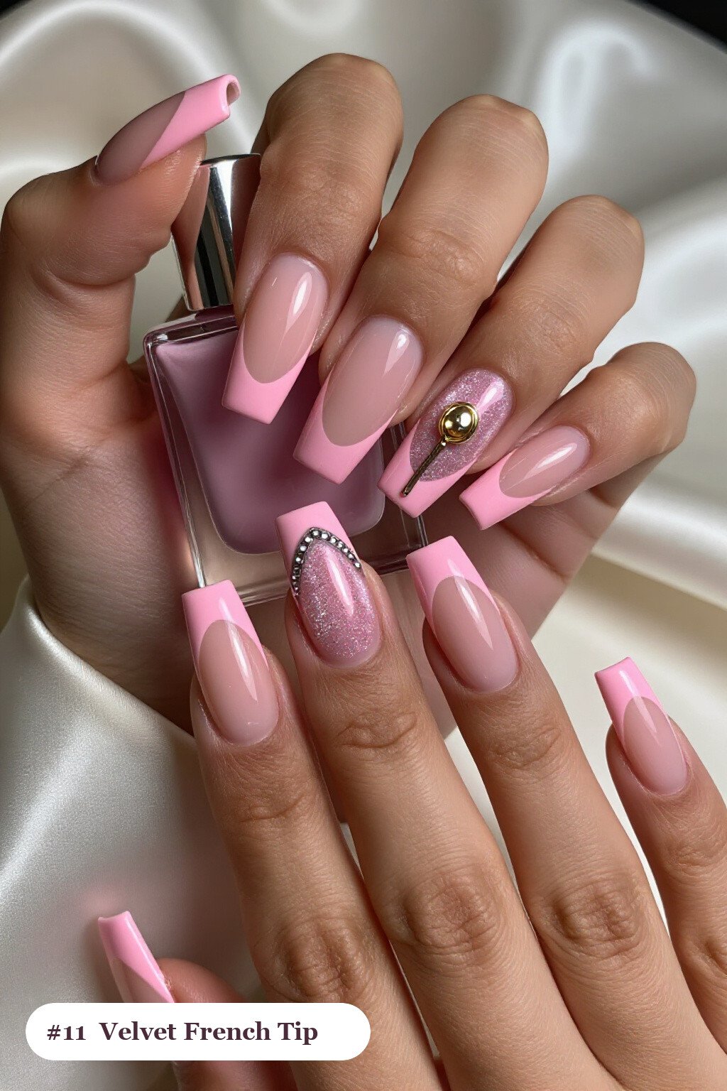 Long square pink no french tip nails with crisp french tips clearly visible on every nail, styled with a velvet shimmer finish with one glossy accent nail with a gold charm, with silver details - pink nails no french tip