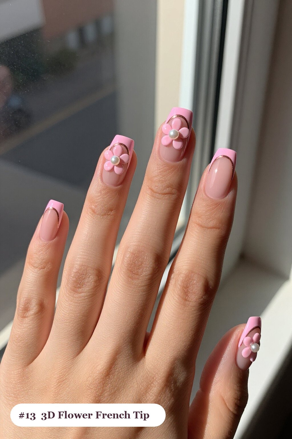 Medium square pink no french tip nails with crisp french tips clearly visible on every nail, styled with raised 3D flowers with pearl centres on two accent nails, with rose gold details - pink nails no french tip