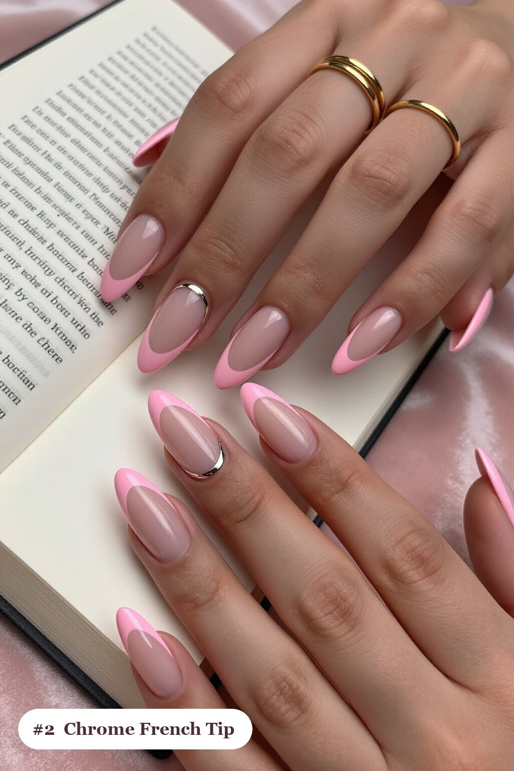 Long almond pink no french tip nails with crisp french tips clearly visible on every nail, styled with a liquid chrome mirror finish and bright metallic highlights, with soft nude details - pink nails no french tip