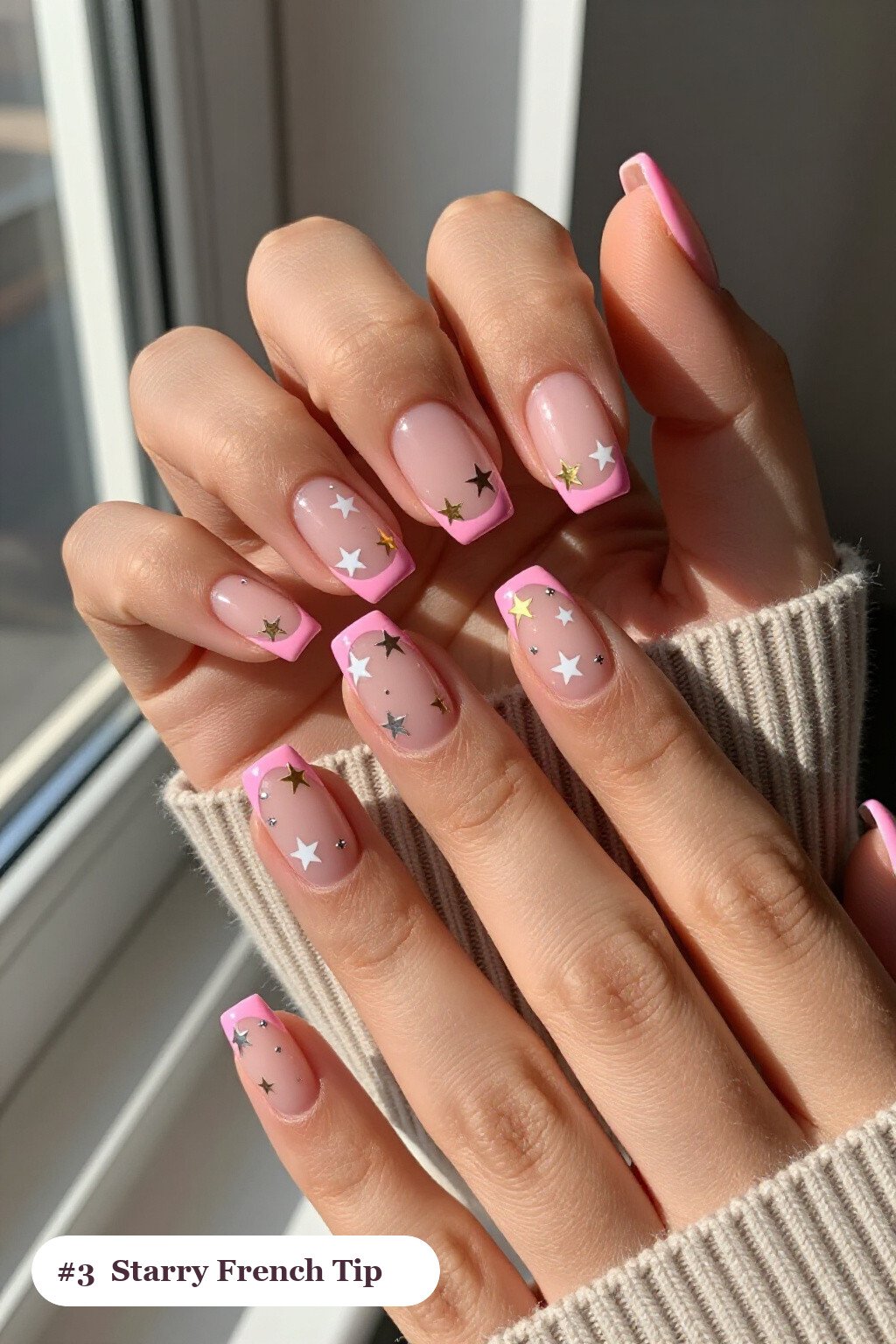 Medium square pink no french tip nails with crisp french tips clearly visible on every nail, styled with white and gold stars and sparkles painted on every nail, with silver details - pink nails no french tip