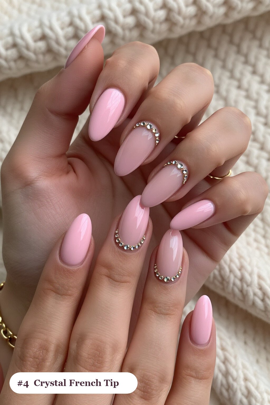 Medium almond pink no french tip nails with crisp french tips clearly visible on every nail, styled with rows of sparkling crystal rhinestones along the cuticle of every nail, with gold details - pink nails no french tip