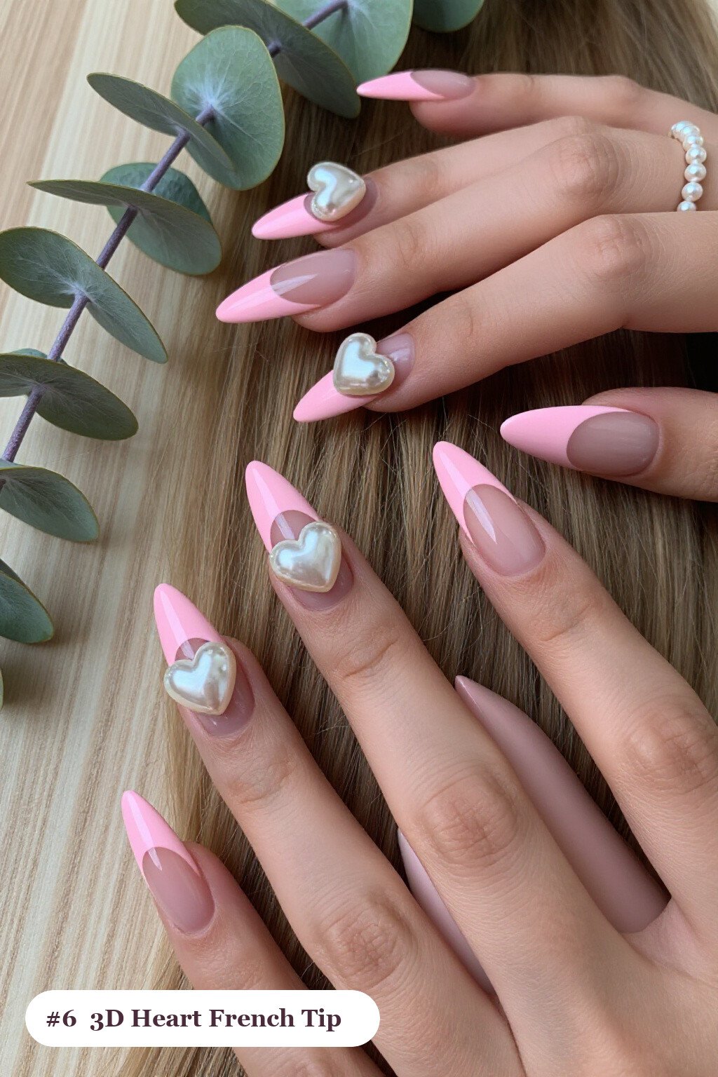 Long stiletto pink no french tip nails with crisp french tips clearly visible on every nail, styled with chunky 3D gel hearts and pearls on three nails, with pearl details - pink nails no french tip