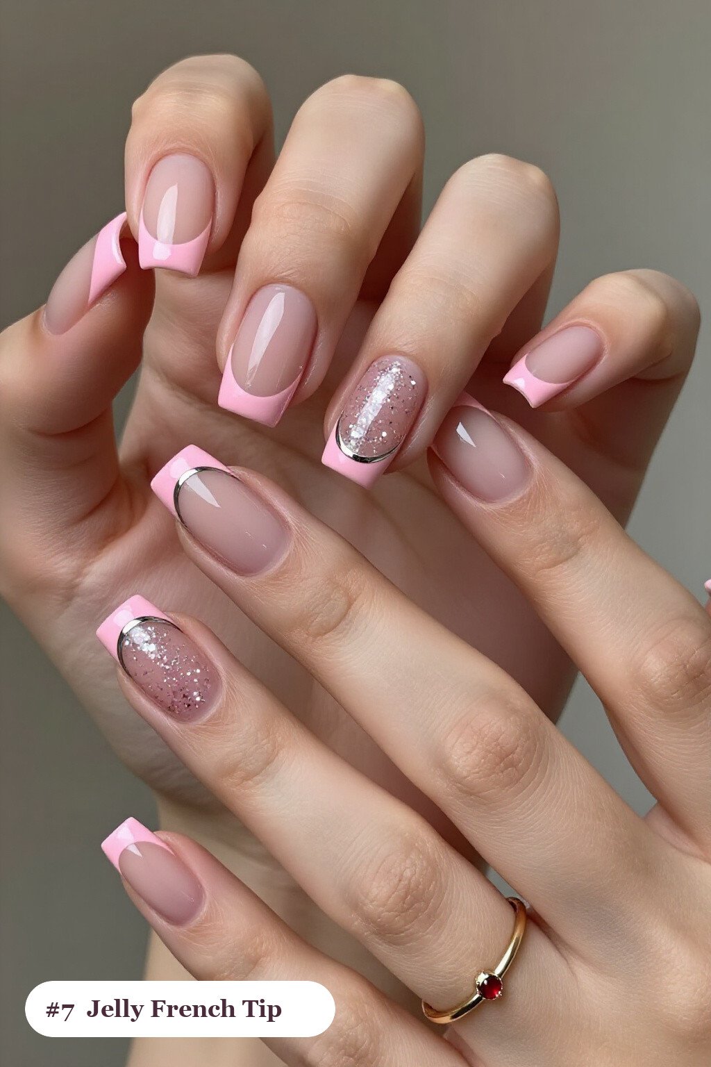 Short square pink no french tip nails with crisp french tips clearly visible on every nail, styled with a see-through jelly finish with encapsulated glitter, with silver chrome details - pink nails no french tip