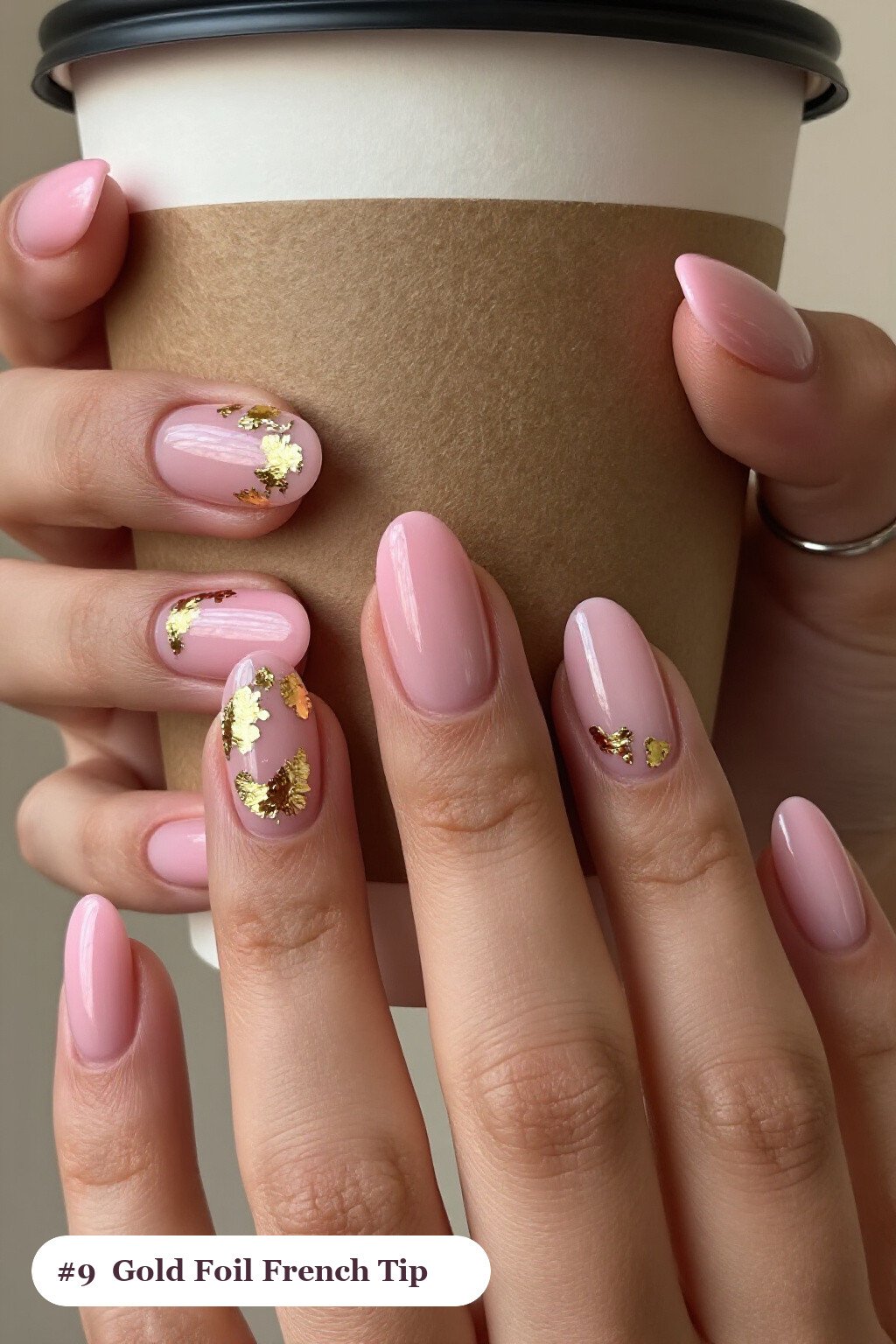Medium oval pink no french tip nails with crisp french tips clearly visible on every nail, styled with dense gold foil flakes and gold leaf scattered across every nail, with gold details - pink nails no french tip