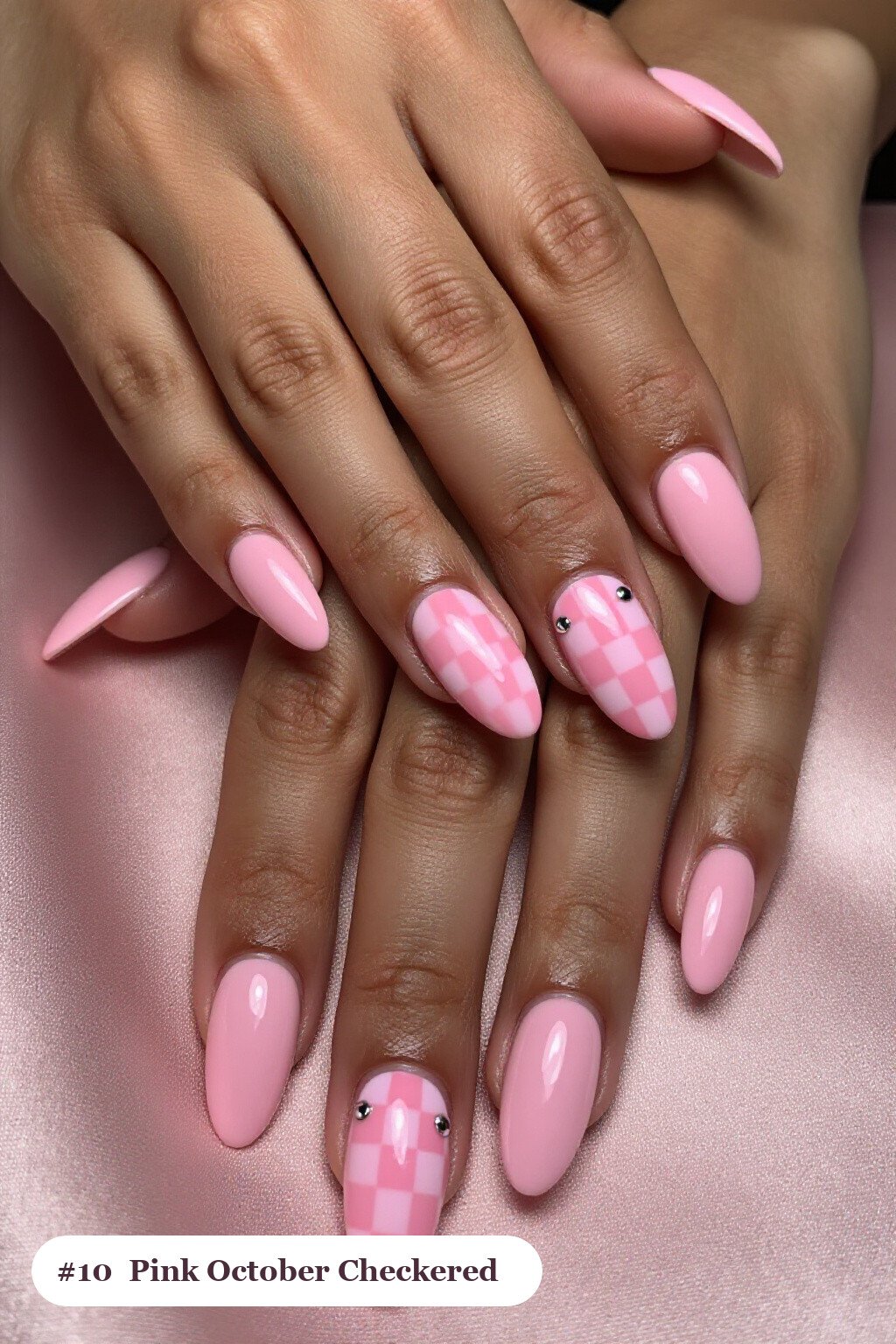 Long ballerina pink october nails with a bold checkerboard pattern on two accent nails and solid colour on the rest, with silver chrome details - pink october nail designs Long ballerina pink october nails with a bold checkerboard pattern on two accent nails and solid colour on the rest, with silver chrome details - pink october nail designs