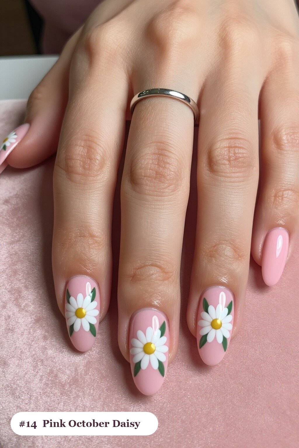 Medium coffin pink october nails with hand-painted daisies and green leaves across every nail, with champagne details - pink october nail designs Medium coffin pink october nails with hand-painted daisies and green leaves across every nail, with champagne details - pink october nail designs