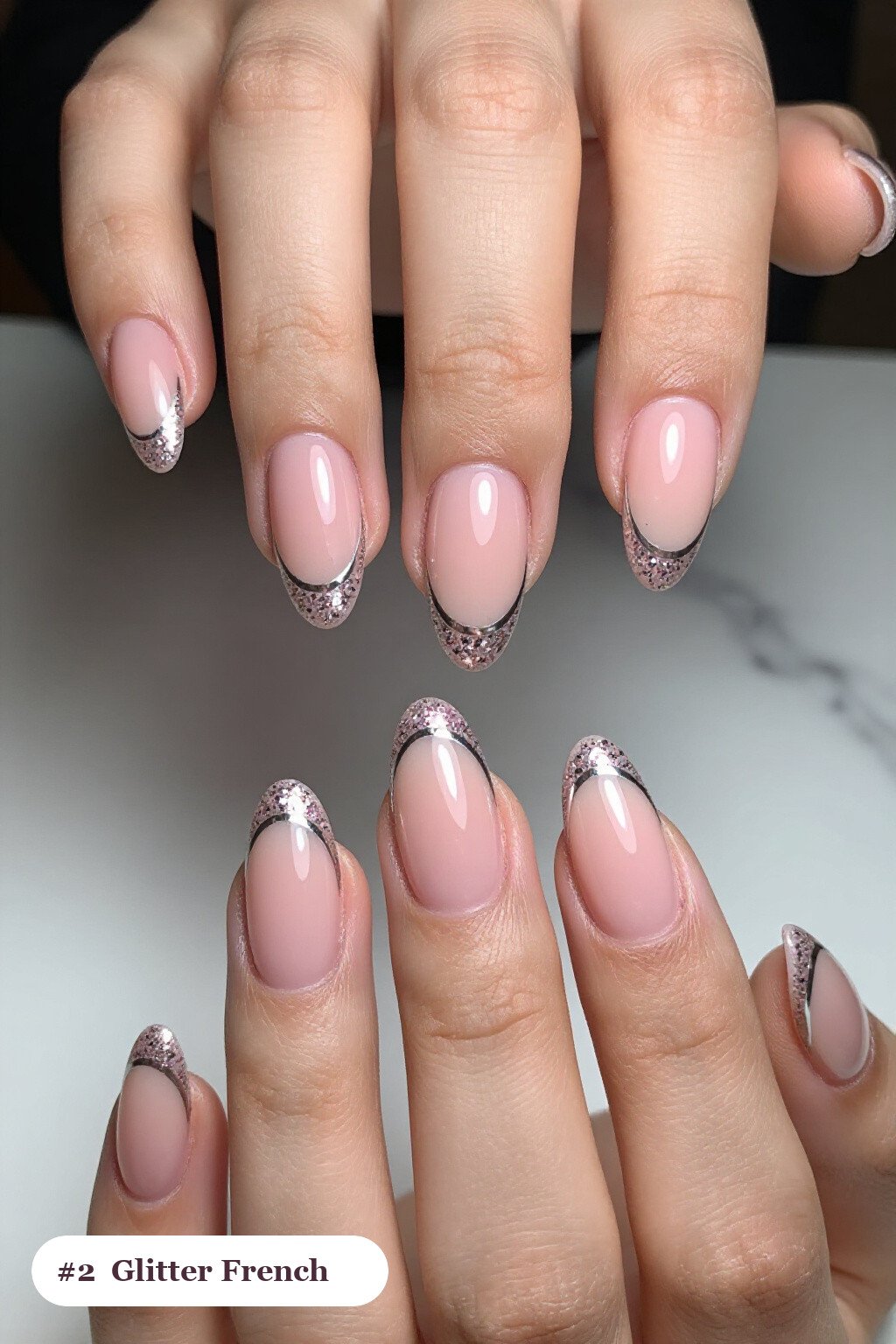 Medium almond pink october nails with glitter-packed french tips over a sheer nude base, with silver chrome details - pink october nail designs Medium almond pink october nails with glitter-packed french tips over a sheer nude base, with silver chrome details - pink october nail designs
