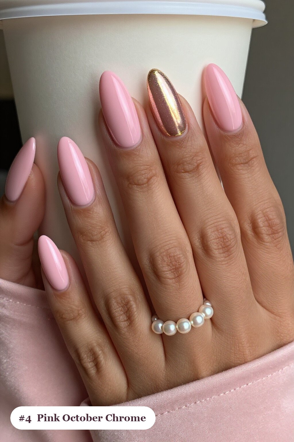 Medium coffin pink october nails with a liquid chrome mirror finish and bright metallic highlights, with gold details - pink october nail designs Medium coffin pink october nails with a liquid chrome mirror finish and bright metallic highlights, with gold details - pink october nail designs