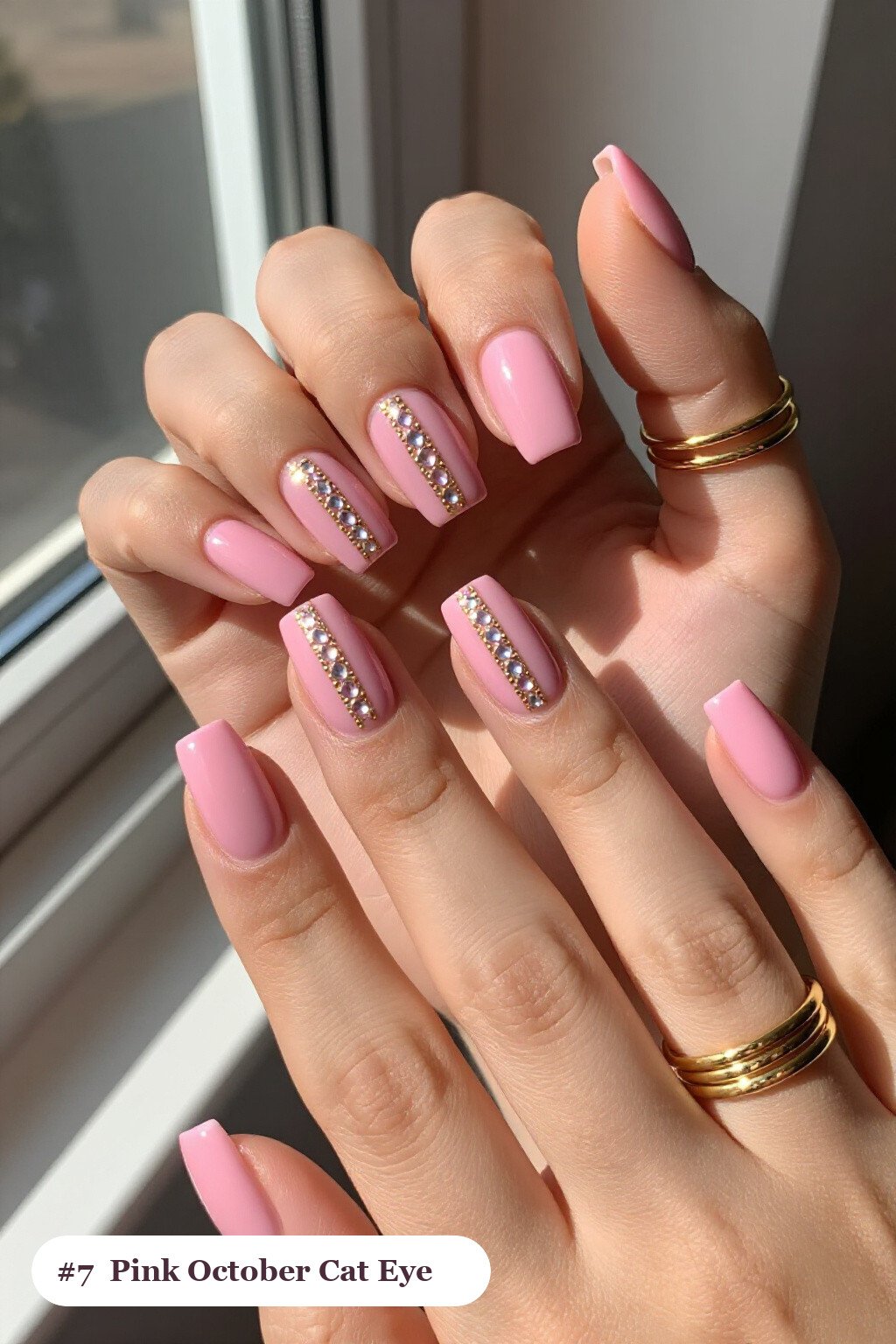 Medium square pink october nails with a glowing shimmer band of light running down the centre of each nail like a gemstone, with gold details - pink october nail designs Medium square pink october nails with a glowing shimmer band of light running down the centre of each nail like a gemstone, with gold details - pink october nail designs