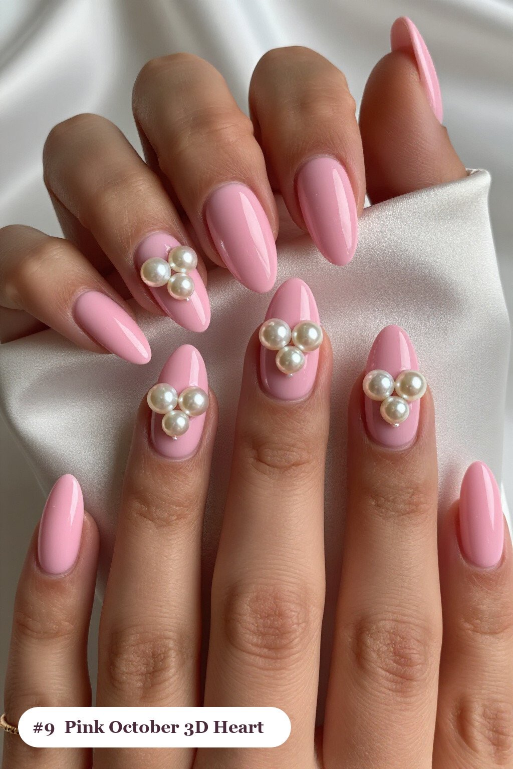 Long coffin pink october nails with chunky 3D gel hearts and pearls on three nails, with pearl details - pink october nail designs Long coffin pink october nails with chunky 3D gel hearts and pearls on three nails, with pearl details - pink october nail designs