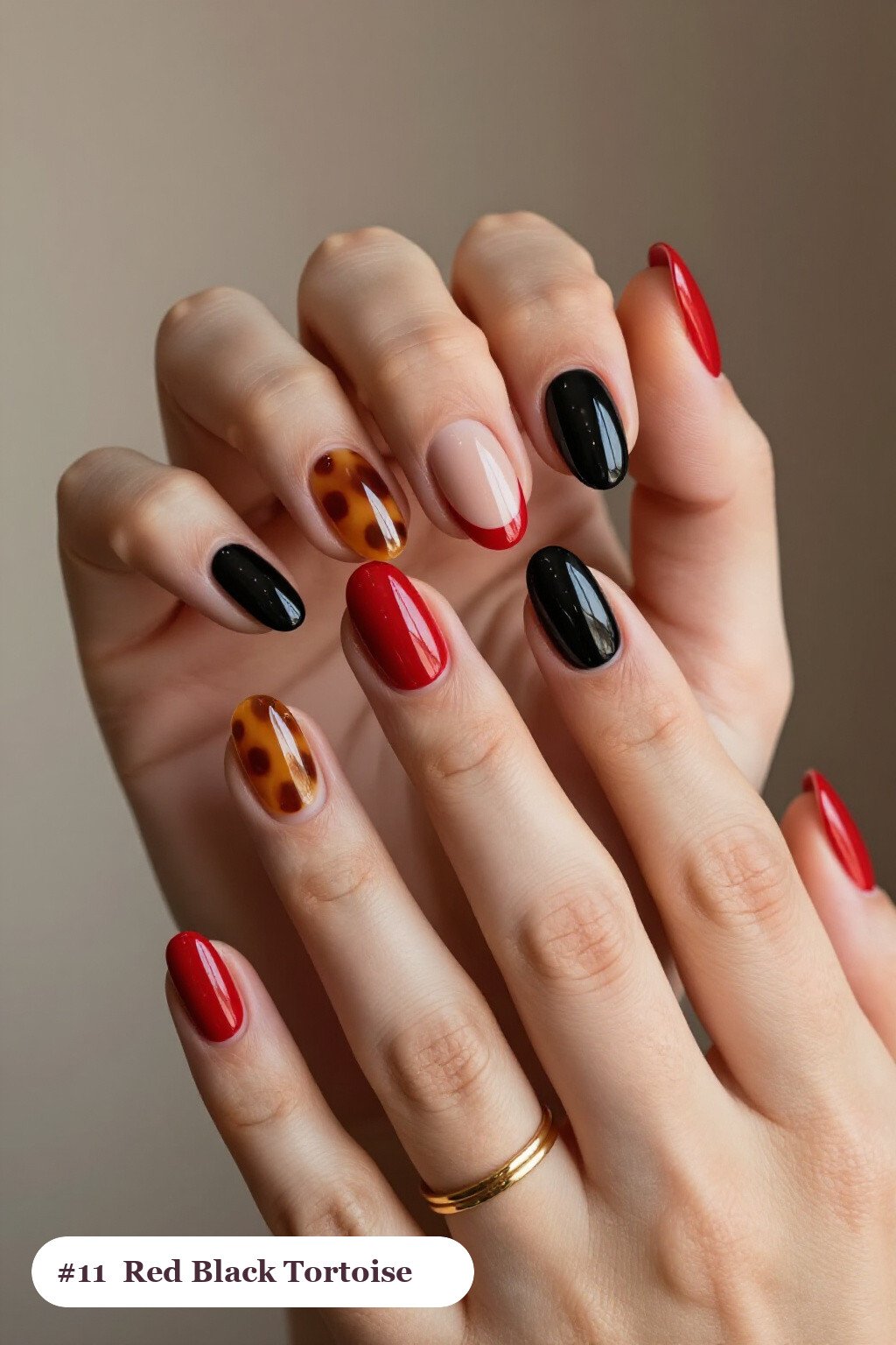 Medium coffin red black nails with glossy amber tortoiseshell on two accent nails, with soft nude details - red and black nails
