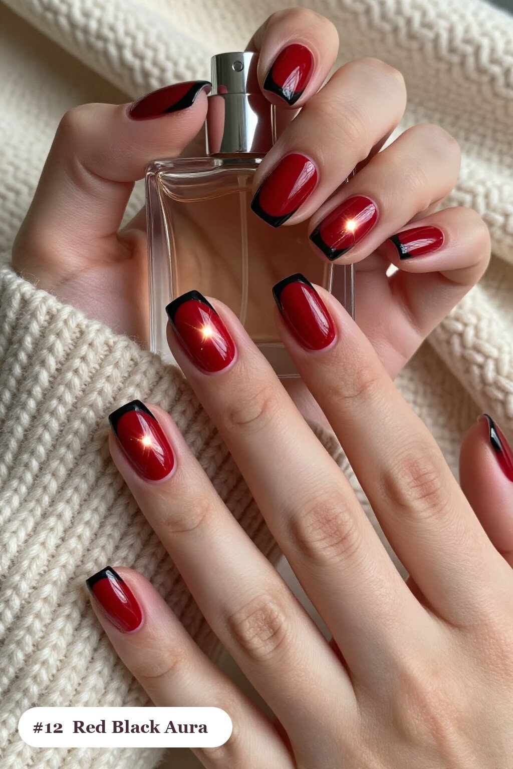 Short square red black nails with a glowing airbrushed aura in the centre of each nail, with gold details - red and black nails