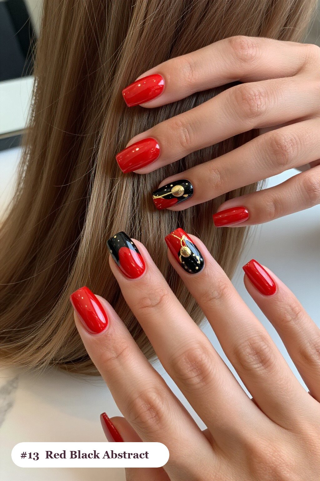 Medium square red black nails with abstract art of colour blobs, gold outlines and dots, with champagne details - red and black nails