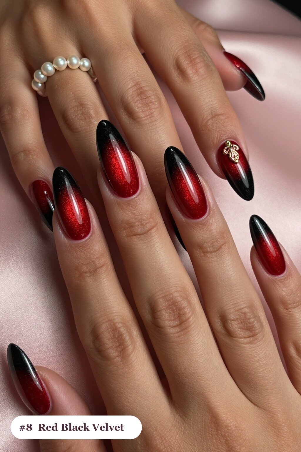 Long almond red black nails in a velvet shimmer finish with one glossy accent nail with a gold charm, with rose gold details - red and black nails