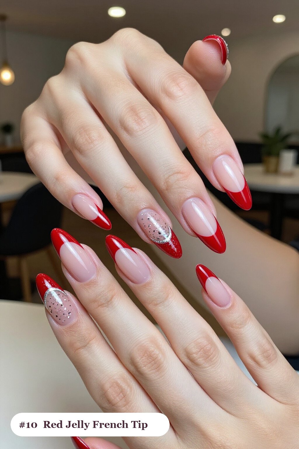 Long stiletto red french nails with crisp french tips clearly visible on every nail, styled with a see-through jelly finish with encapsulated glitter, with silver details - red french nails Long stiletto red french nails with crisp french tips clearly visible on every nail, styled with a see-through jelly finish with encapsulated glitter, with silver details - red french nails