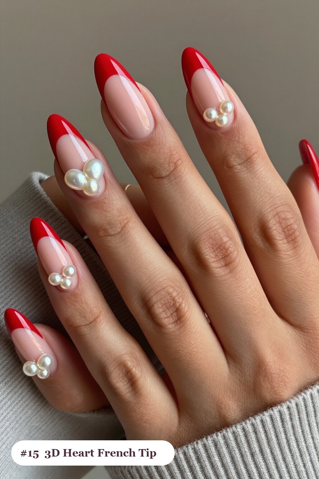 Medium coffin red french nails with crisp french tips clearly visible on every nail, styled with chunky 3D gel hearts and pearls on three nails, with champagne details - red french nails Medium coffin red french nails with crisp french tips clearly visible on every nail, styled with chunky 3D gel hearts and pearls on three nails, with champagne details - red french nails