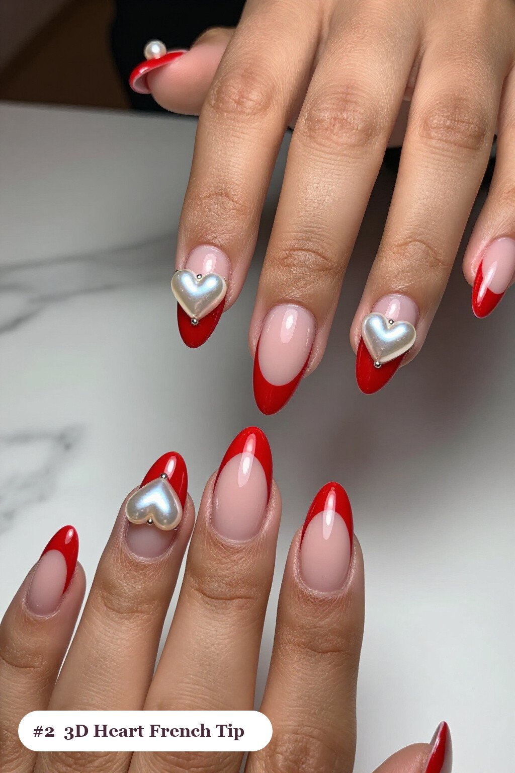Long coffin red french nails with crisp french tips clearly visible on every nail, styled with chunky 3D gel hearts and pearls on three nails, with silver details - red french nails Long coffin red french nails with crisp french tips clearly visible on every nail, styled with chunky 3D gel hearts and pearls on three nails, with silver details - red french nails