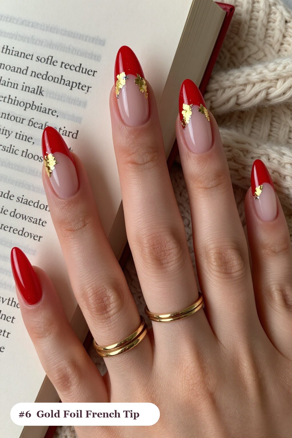 Long almond red french nails with crisp french tips clearly visible on every nail, styled with dense gold foil flakes and gold leaf scattered across every nail, with silver chrome details - red french nails Long almond red french nails with crisp french tips clearly visible on every nail, styled with dense gold foil flakes and gold leaf scattered across every nail, with silver chrome details - red french nails