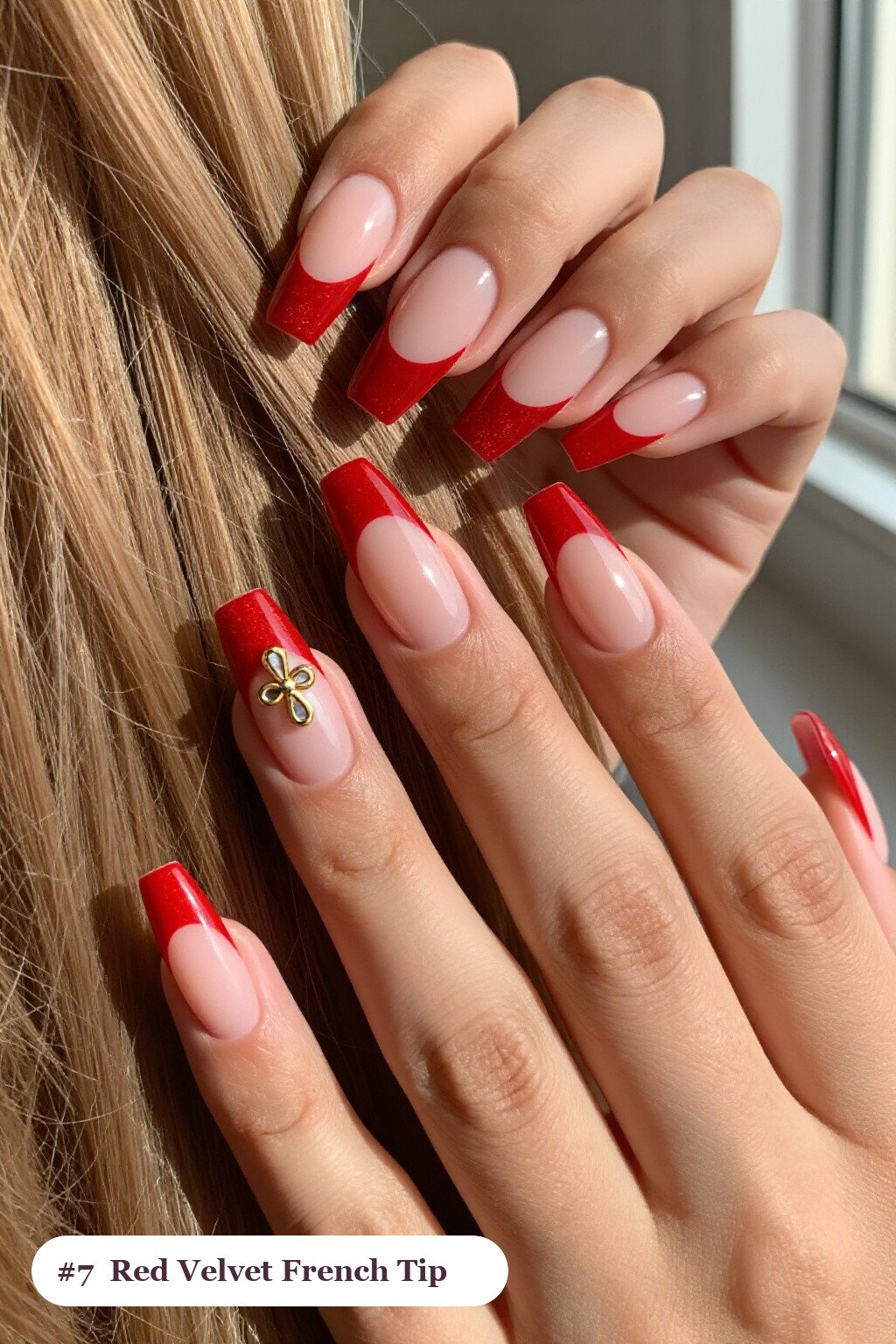 Long square red french nails with crisp french tips clearly visible on every nail, styled with a velvet shimmer finish with one glossy accent nail with a gold charm, with champagne details - red french nails Long square red french nails with crisp french tips clearly visible on every nail, styled with a velvet shimmer finish with one glossy accent nail with a gold charm, with champagne details - red french nails