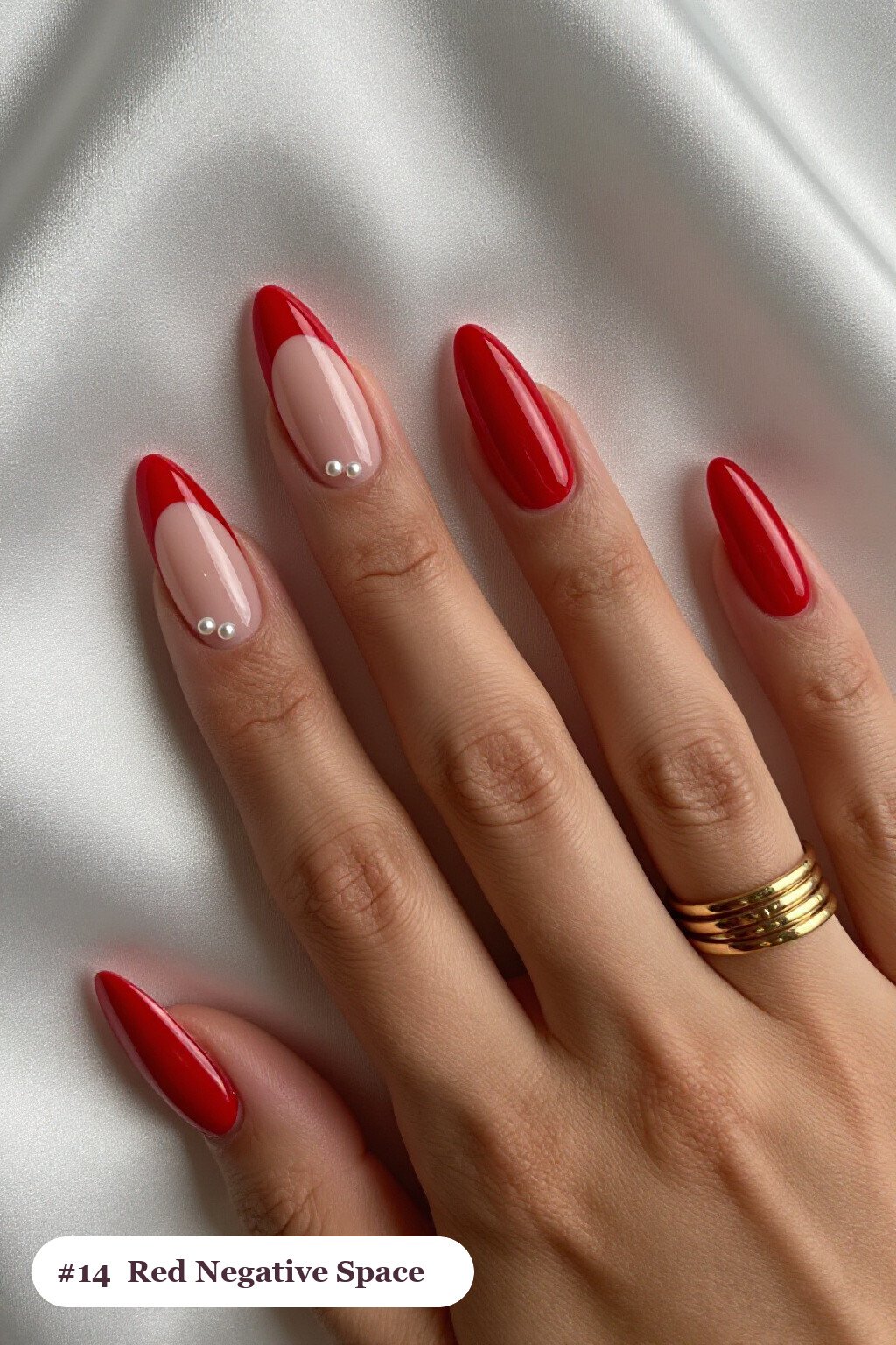 Long coffin red nails in a negative-space design with sheer nude windows and bold colour shapes, with pearl details - red nails