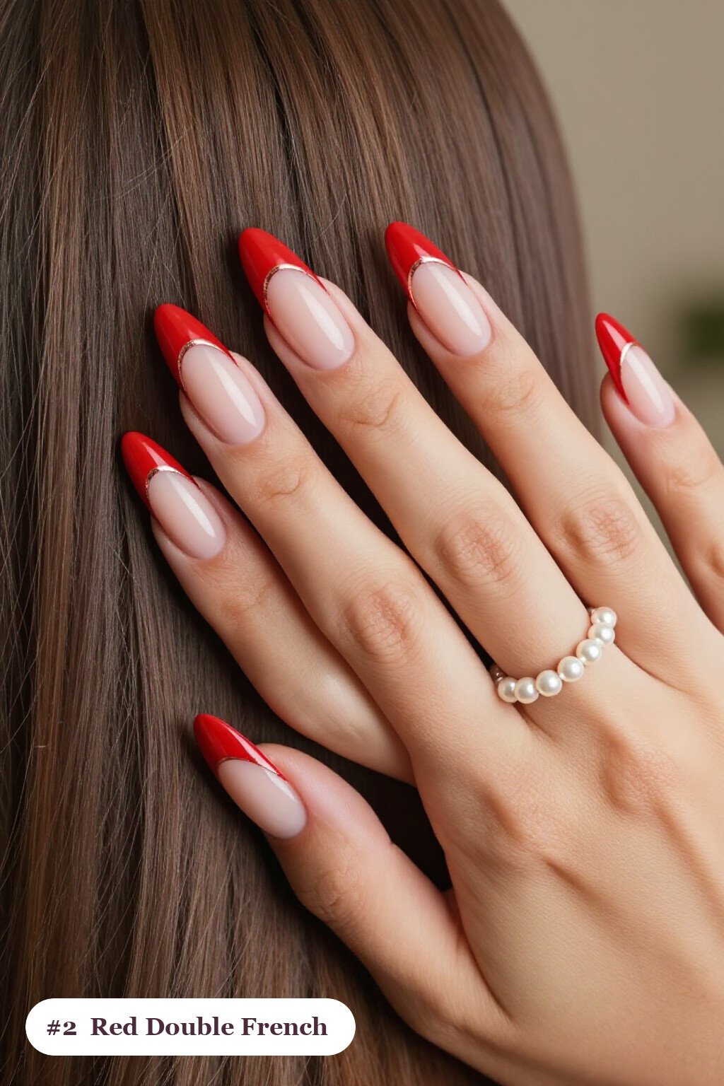 Long almond red nails with double-line french tips in two colours, with rose gold details - red nails