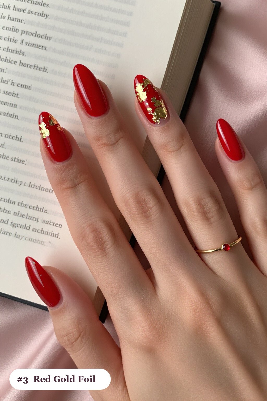 Medium almond red nails with dense gold foil flakes and gold leaf scattered across every nail, with silver chrome details - red nails