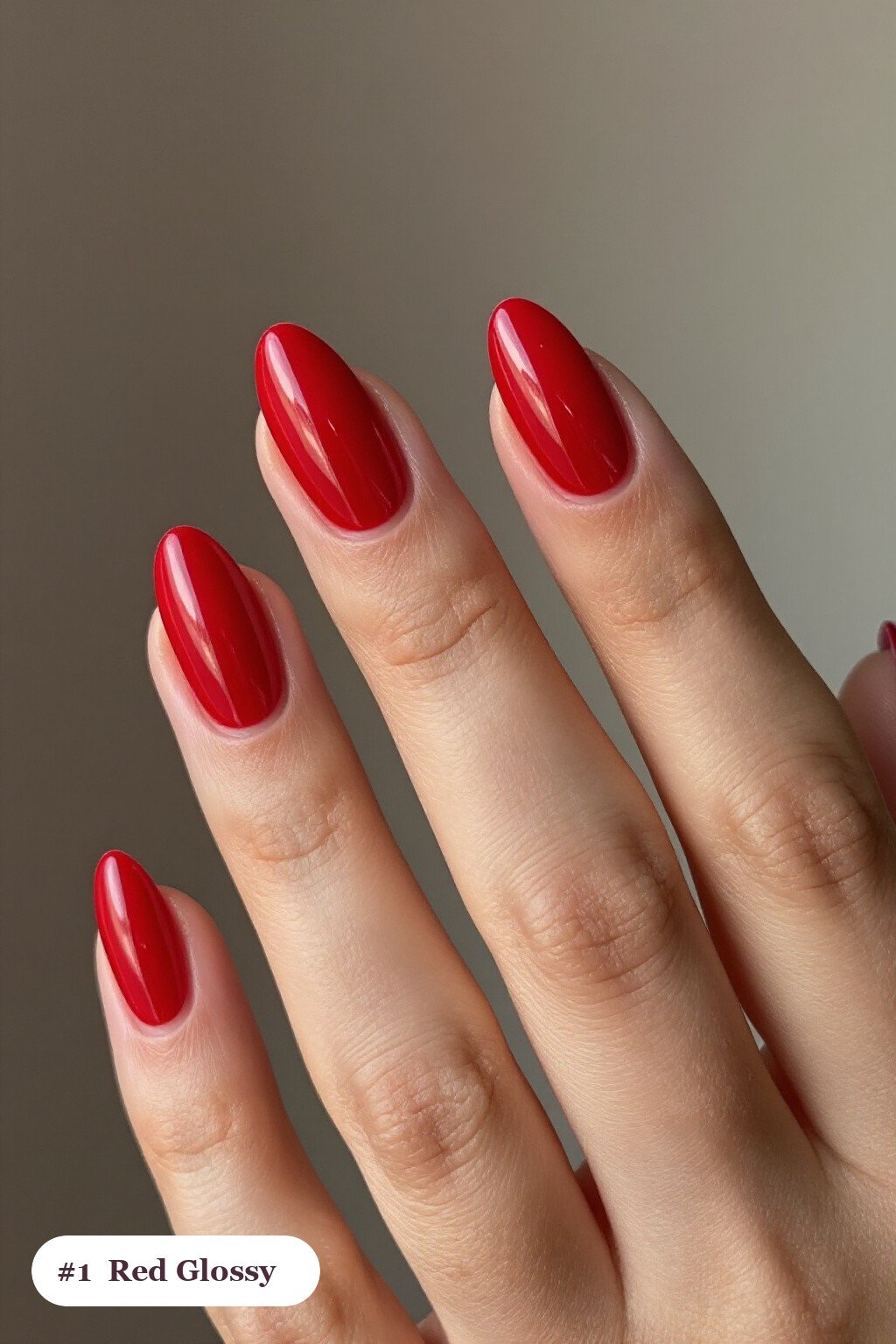 Medium almond red nails in a flawless mirror-glossy full-colour finish - red nails almond